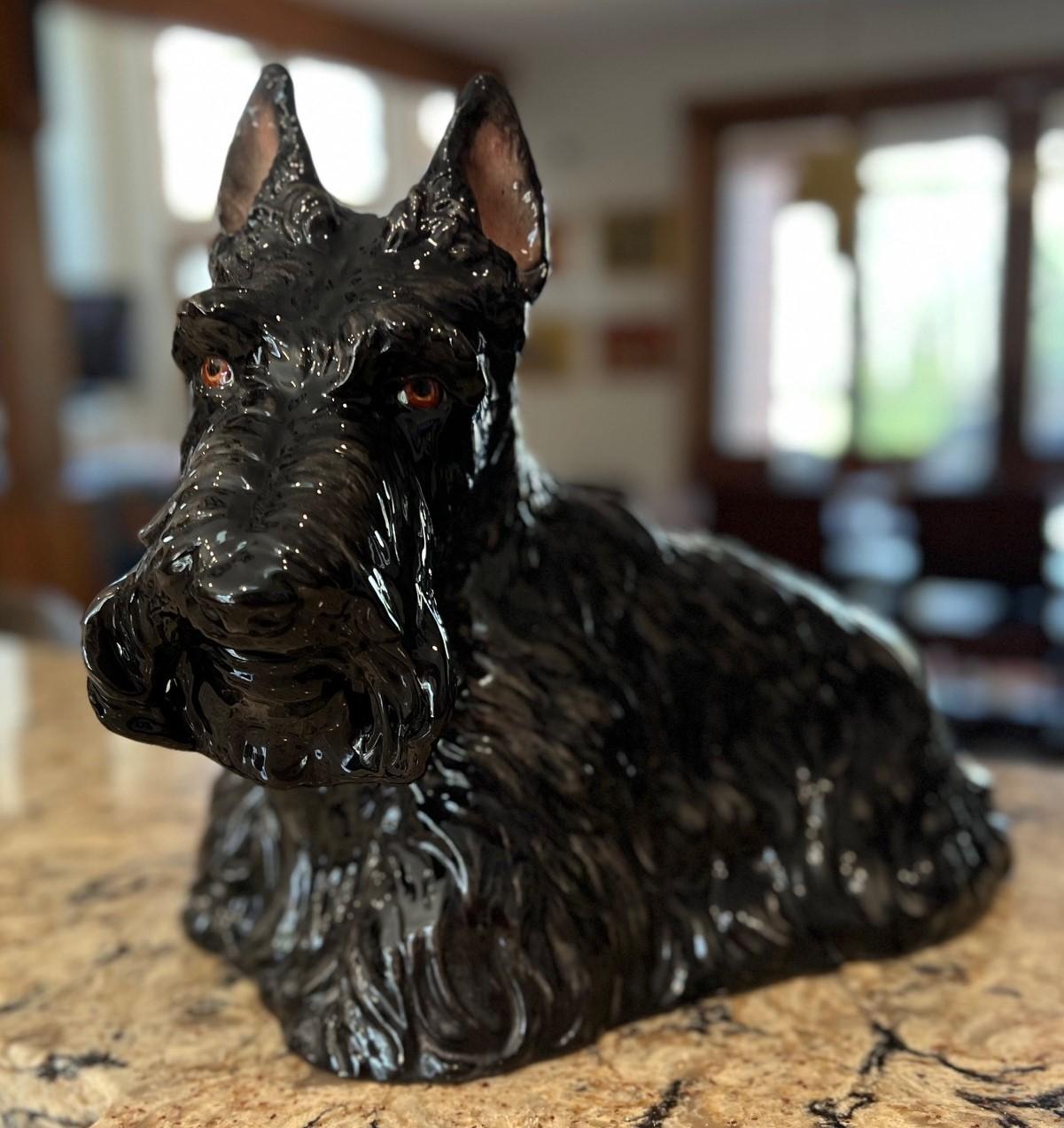 Vintage 1970's American sculpted ceramic Scottish Terrier figure by The Townsends. Depicted in a seated position this Scottie dog has been sculpted with incredible lifelike details. The resultant ceramic is crisp and has been painted and glazed to 