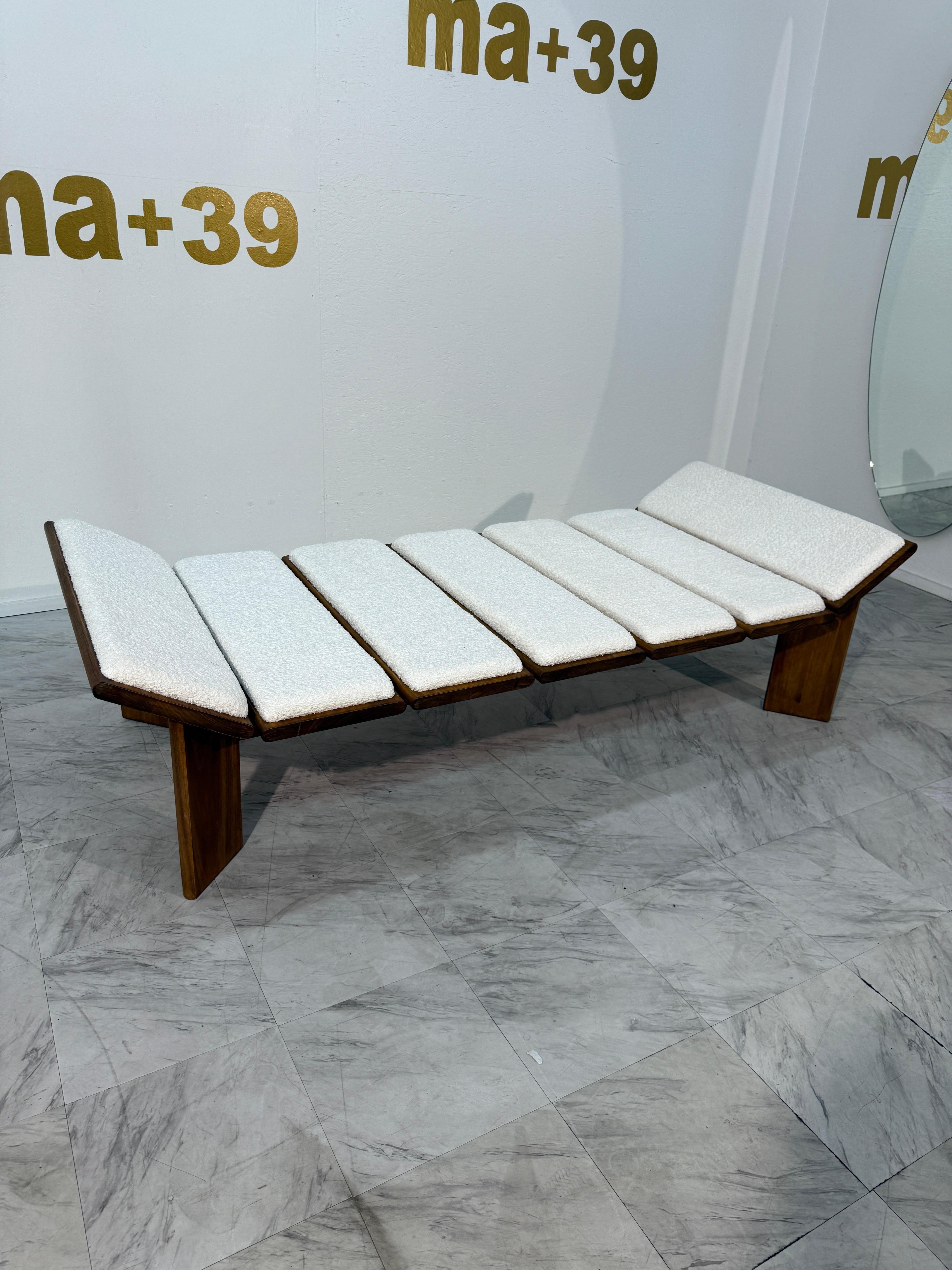 This stunning vintage Italian chaise lounge blends sculptural form with everyday comfort. Crafted in the 1970s, it reflects classic mid-century modern design and Italian craftsmanship. The warm solid wood frame features angular legs and clean lines,