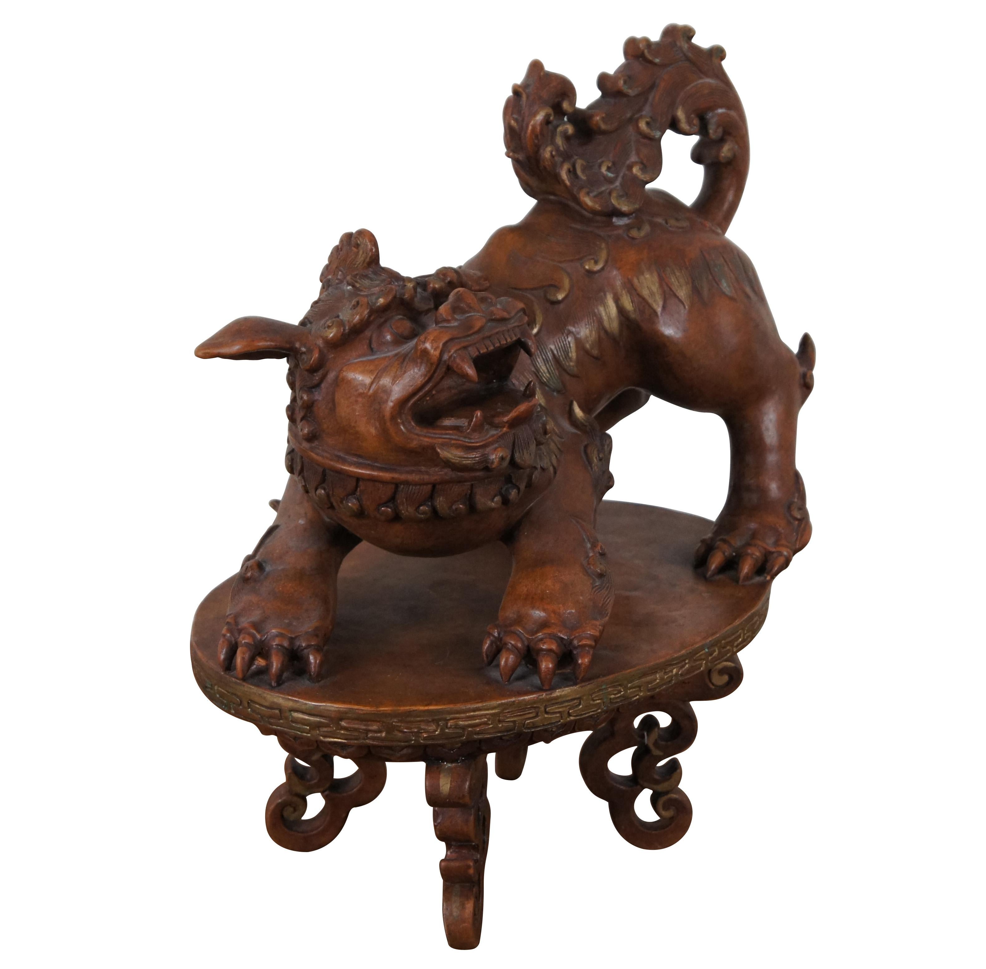 Vintage Italian chalkware painted sculpture / statue in the shape of a Chinese guardian lion / foo dog, standing on a pedestal or stool. Signed along underside.