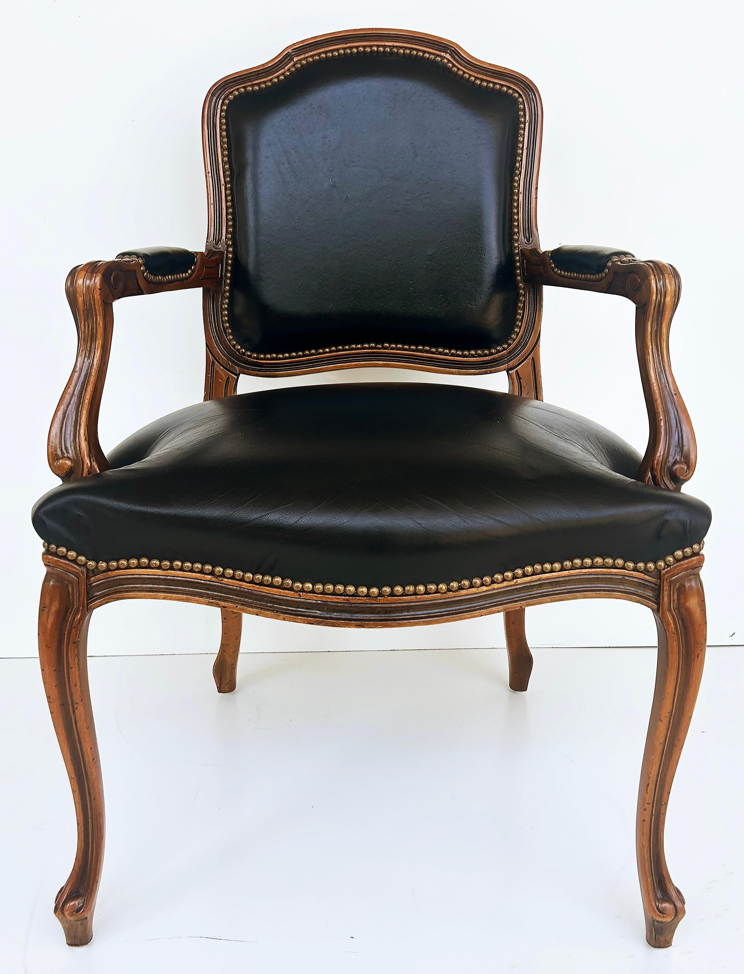 Vintage Italian Chateau D'Ax Leather Armchairs with Brass Nailhead Details, Pair

Offered for sale is a pair of Italian black leather upholstered armchairs with brass nailheads by Chateau D'Ax S.P.A. Milano. The chairs are well-made and have an