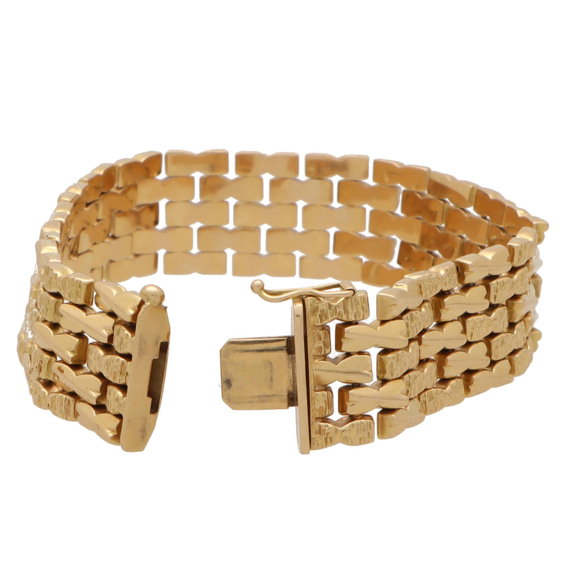 A beautiful vintage chevron brickwork bracelet set in 18k rose gold.

The bracelet is composed of five rows of bowtie-shaped links in a brickwork pattern. The bricks are arranged in a chevron pattern of alternating polished and hammered links. The