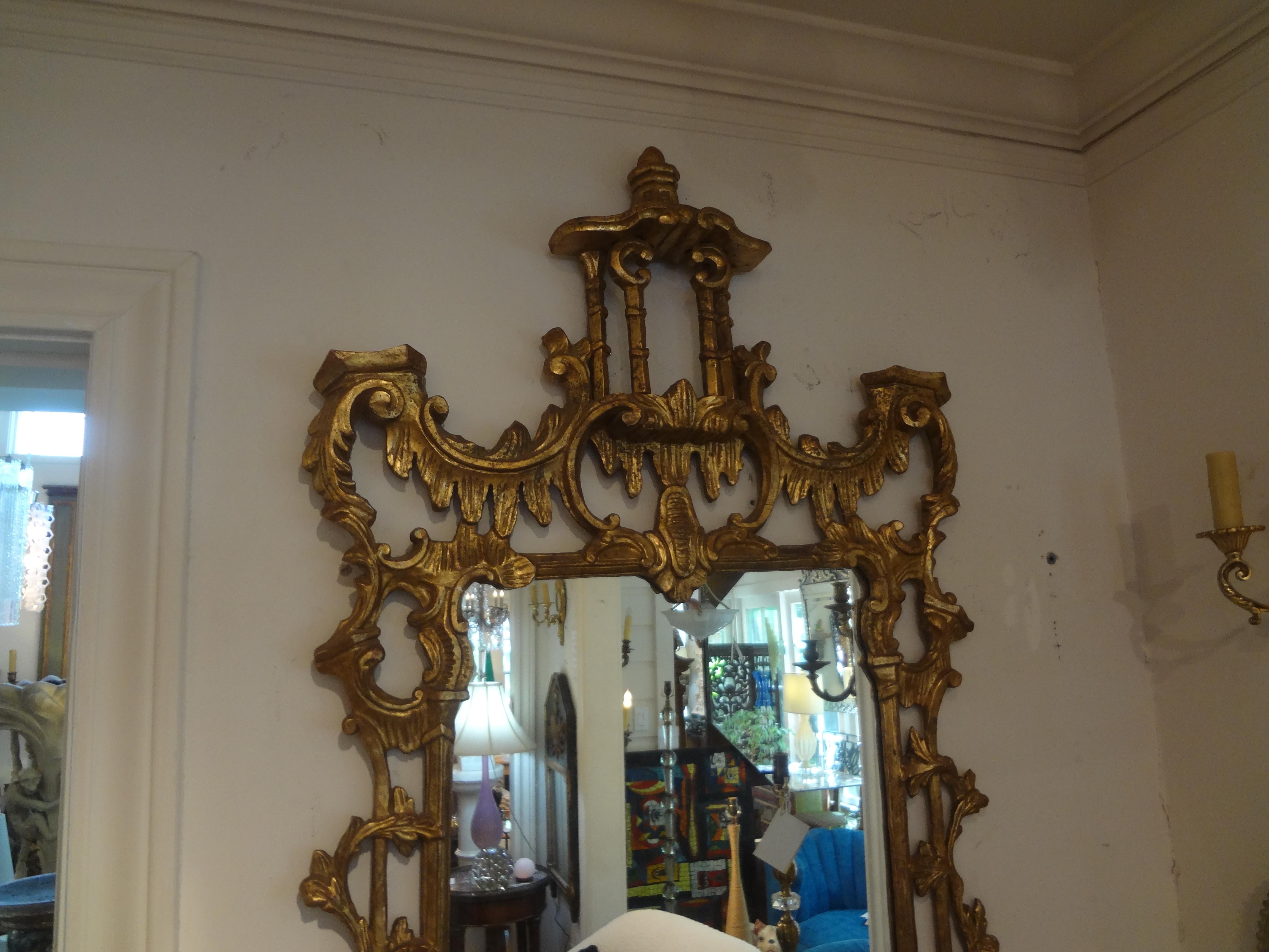 Vintage Italian Chinese Chippendale Style carved giltwood pagoda mirror.
Vintage Chinese Chippendale style carved gilt wood pagoda mirror. This large Chinese Chippendale mirror is the perfect accent for an entrance hall above a console, commode or