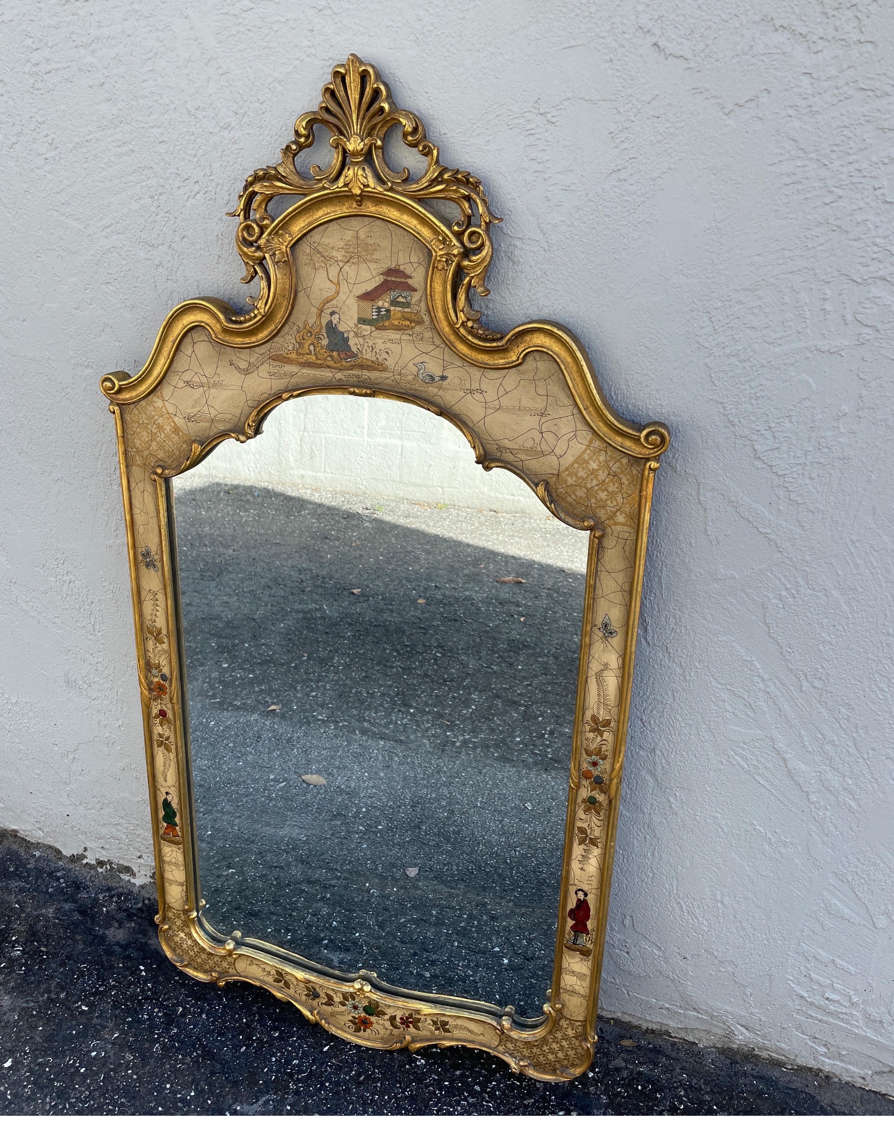 Intricately hand painted Chinoiserie mirror made in Italy in the mid 20th century.
Painted scenes on a crackled background with a gilded border.