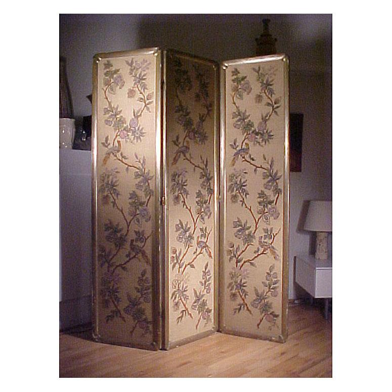 Beautiful vintage Italian chinoiserie or oriental room divider screen with stitched panels of foliage, flowers and birds of different colors. Silver painted sculptural wood frame. Backside is solid fabric color. In the manner of James Mont & Elsie