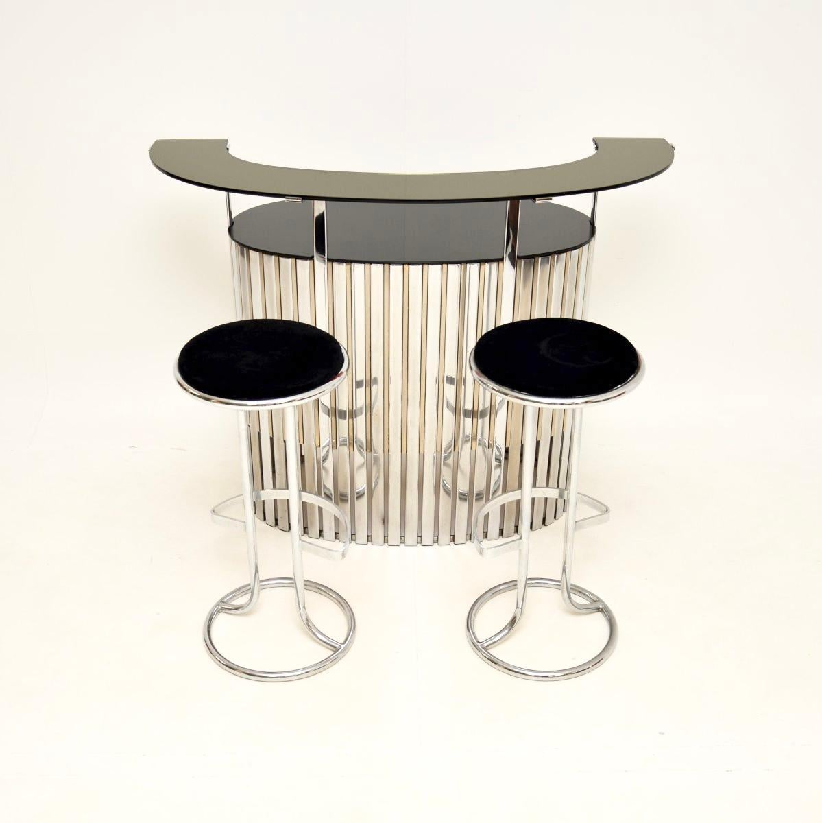 A fantastic vintage Italian chrome bar and pair of stools, dating from the 1970’s.

This is of absolutely amazing quality, the bar is extremely well made and it is very heavy. It is made from strips of chrome plated and brass plated steel, designed