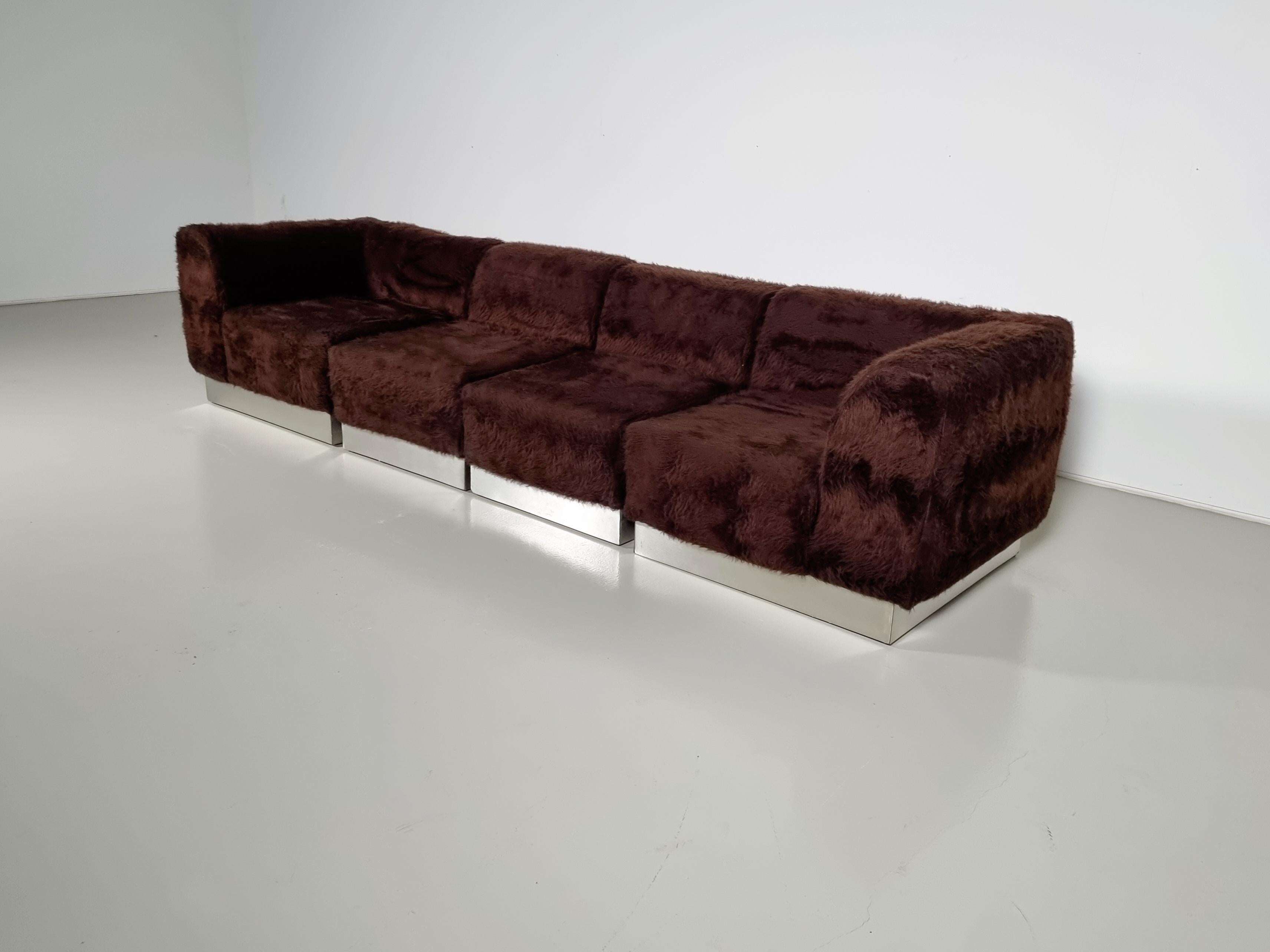Vintage Italian sectional sofa, chrome plated, faux fur, the 1970s

It has a relaxed and easygoing appearance to match its comfort level. This design is a great addition to any sitting or lounge area. In the fabric, you can see a Missoni-like