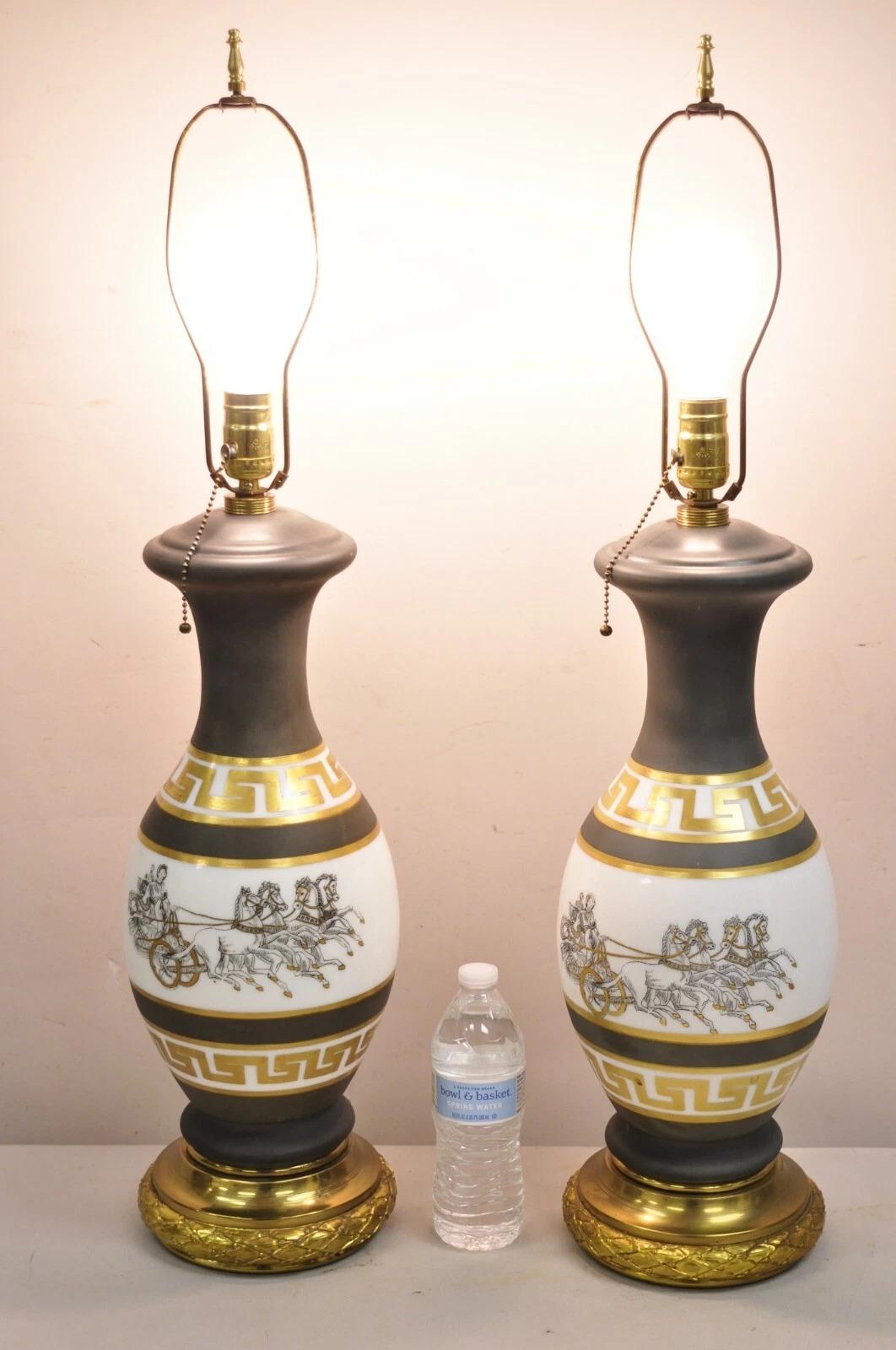 Vintage Hollywood Regency Italian Classical Chariot Gold Greek Key Gray Porcelain Table Lamp Pair. Circa Mid 20th Century. Measurements: 33
