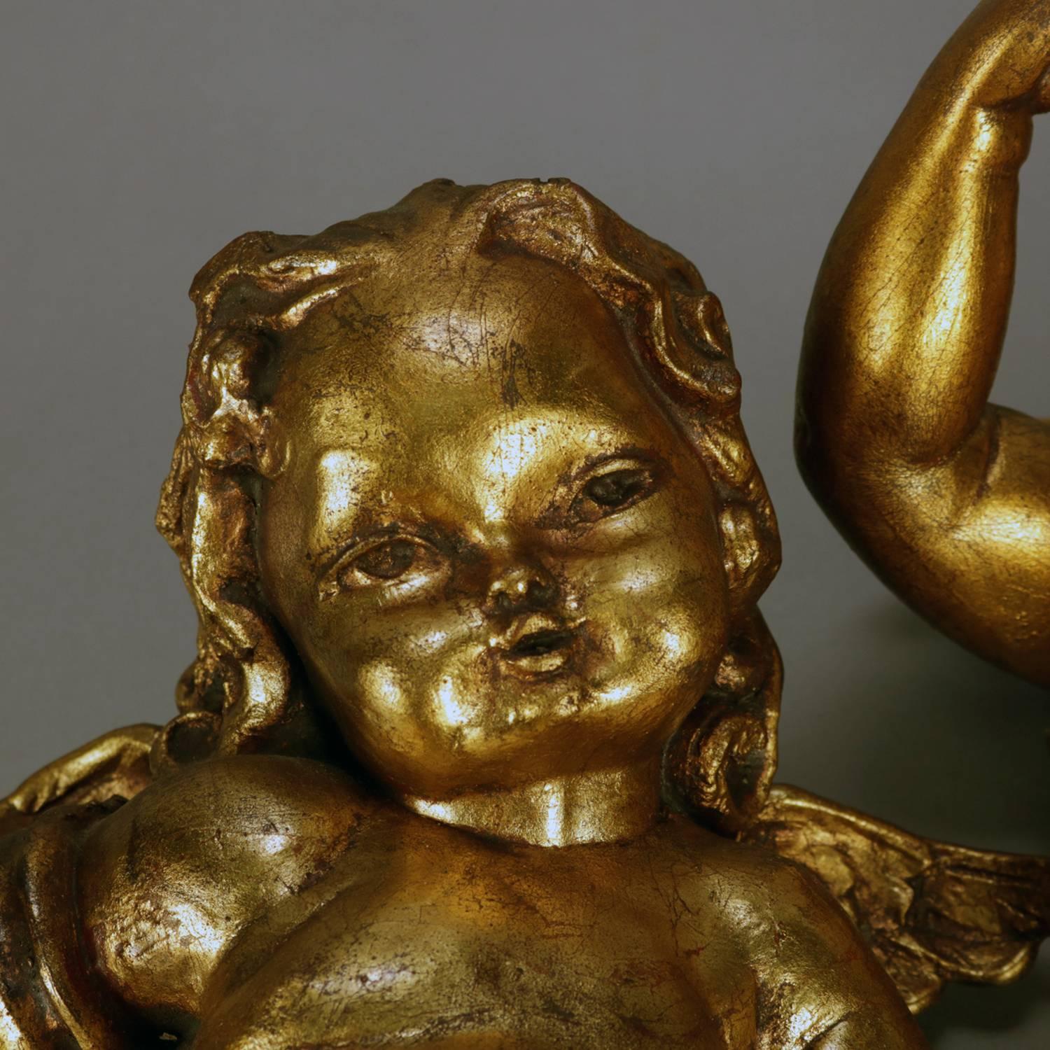 Vintage Italian Classical gilt plaster figural wall mounted sculptures depict musician cherubs, one with cymbals and the other with harp, 20th century

Measures: 18