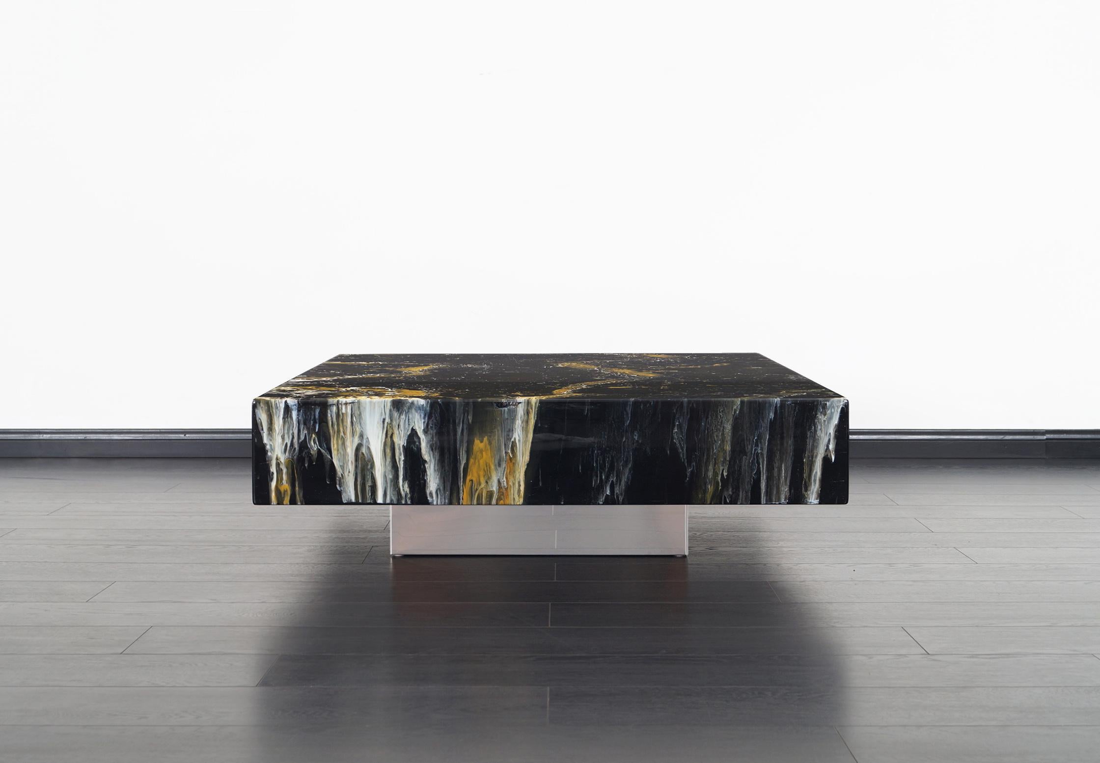 Phenomenal vintage cocktail table designed by Willy Rizzo in Italy, circa 1970s. This stunning design features a faux marble top that sits over a stainless steel base, making it seem like the top is floating mid-air. Willy Rizzo's cocktail tables
