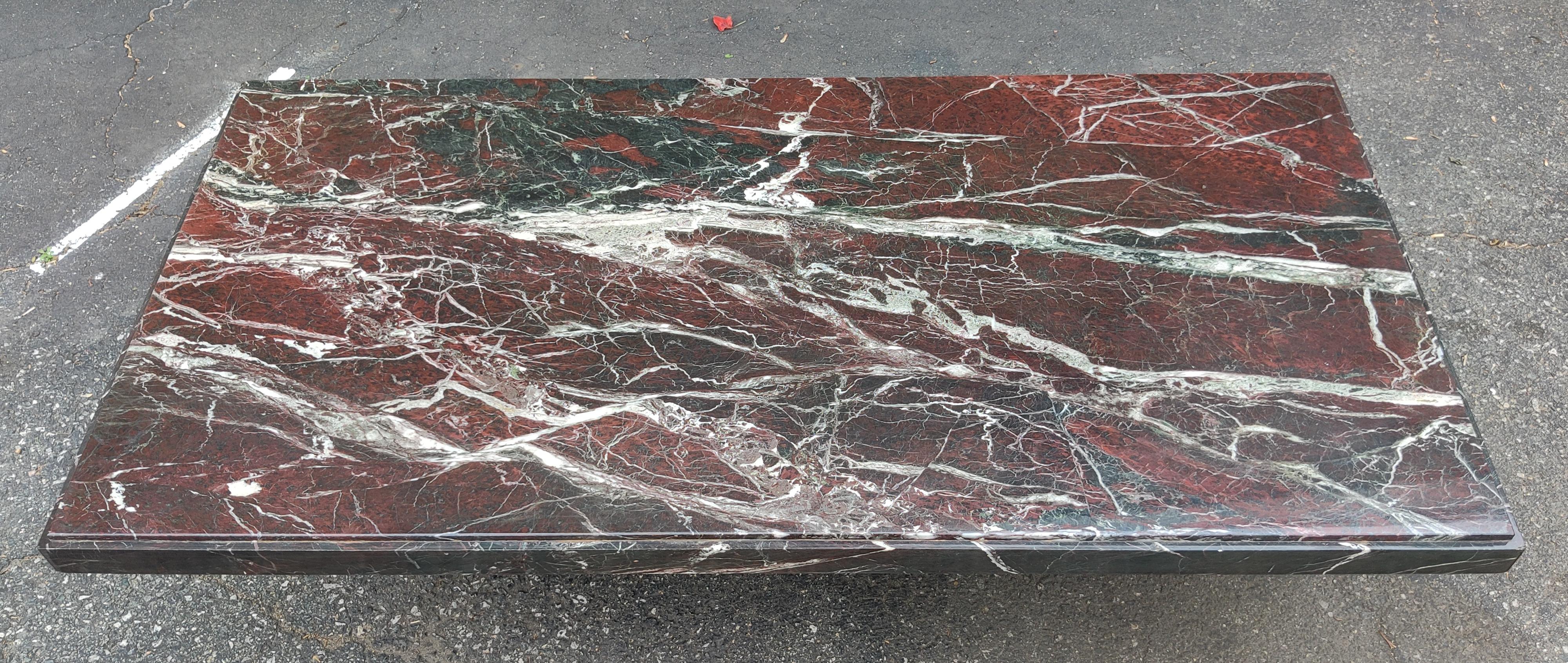 This fantastic coffee table was imported from Italy after its production in the 1970s, and is made of some of the best Rosso Levanto marble we've seen. Typically characterized in a deep red with white streaks, and hints of green, this takes all