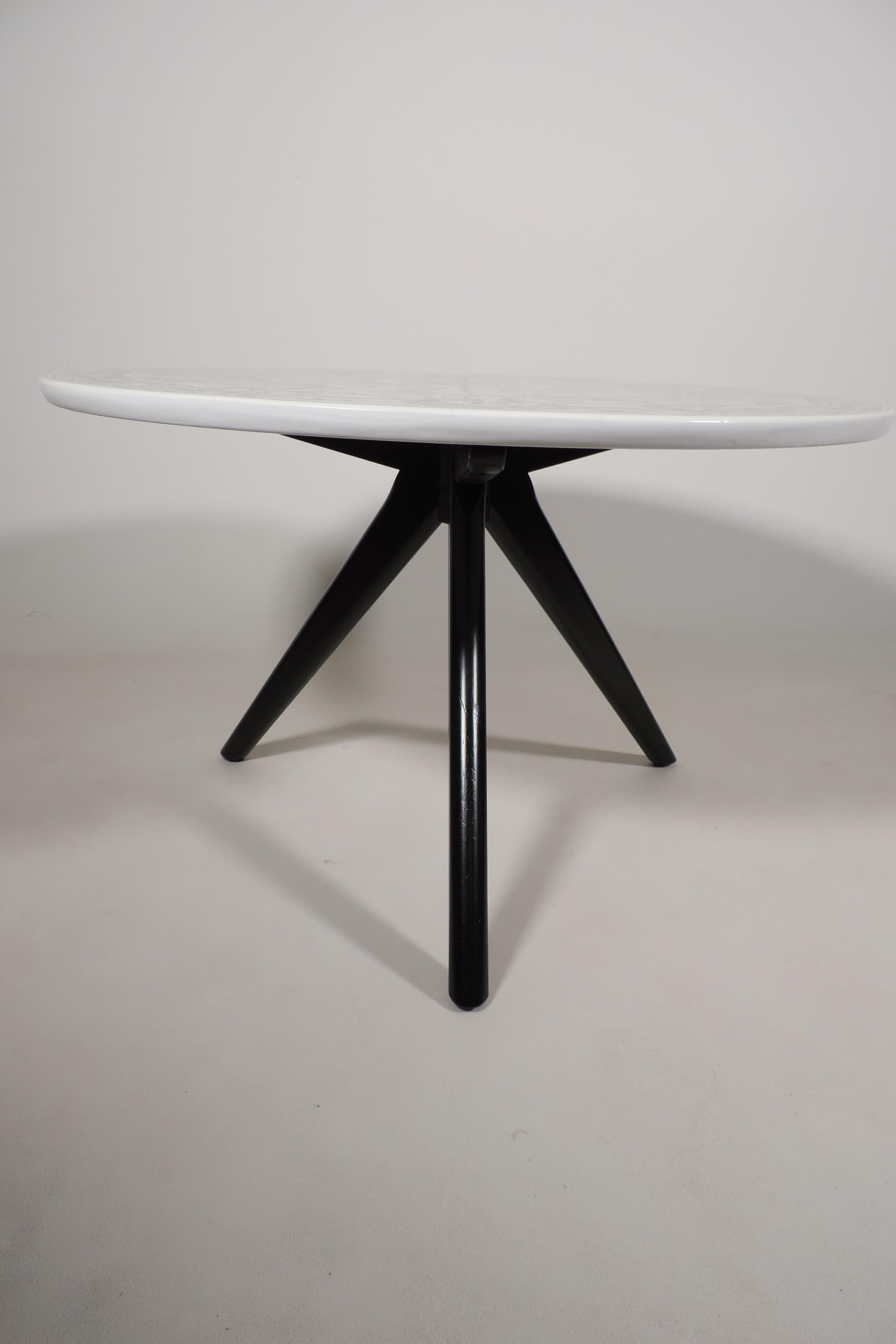 Stunning vintage 1950s low table restyled in our studio. Black atomic tripod legs supporting lacquered white top featuring fantastic print of a Roman church sealing taken from very 17th century engraving (printed direct to surface and sealed with