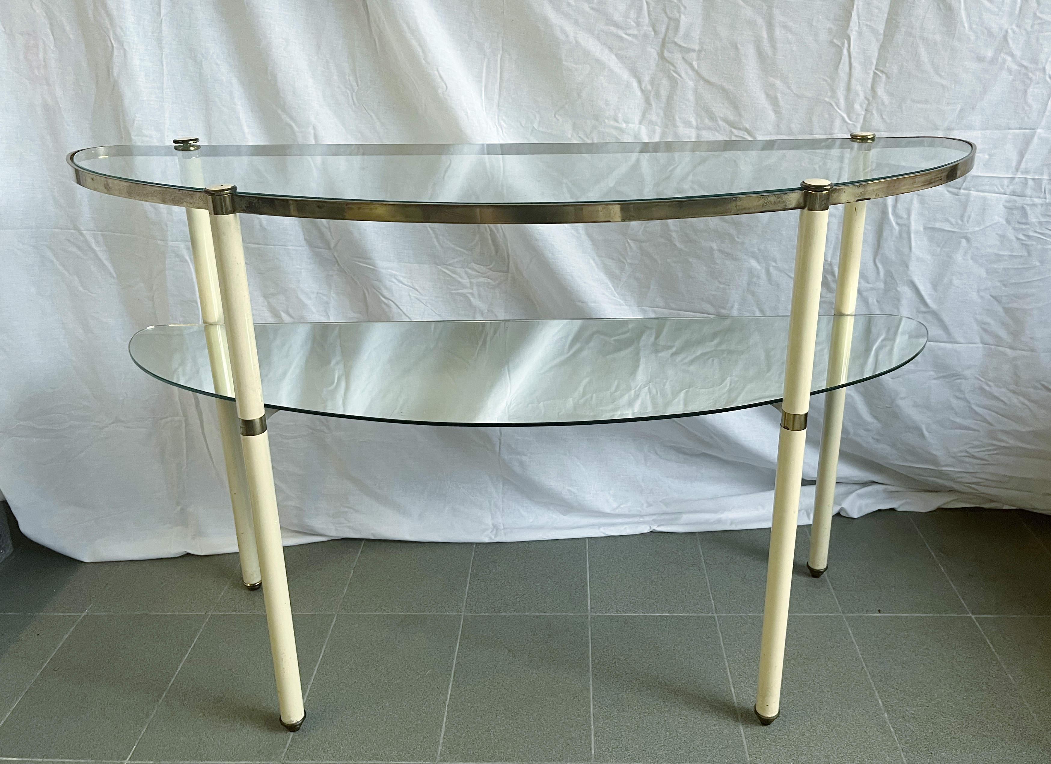 Vintage Italian console table in brass and ivory enameled metal with glass and mirror shelves / made in Italy circa 1960s
Width: 47 inches / height: 29 inches / depth: 15.5 inches
1 available in stock in Italy
Order Reference #: FABIOLTD LS008