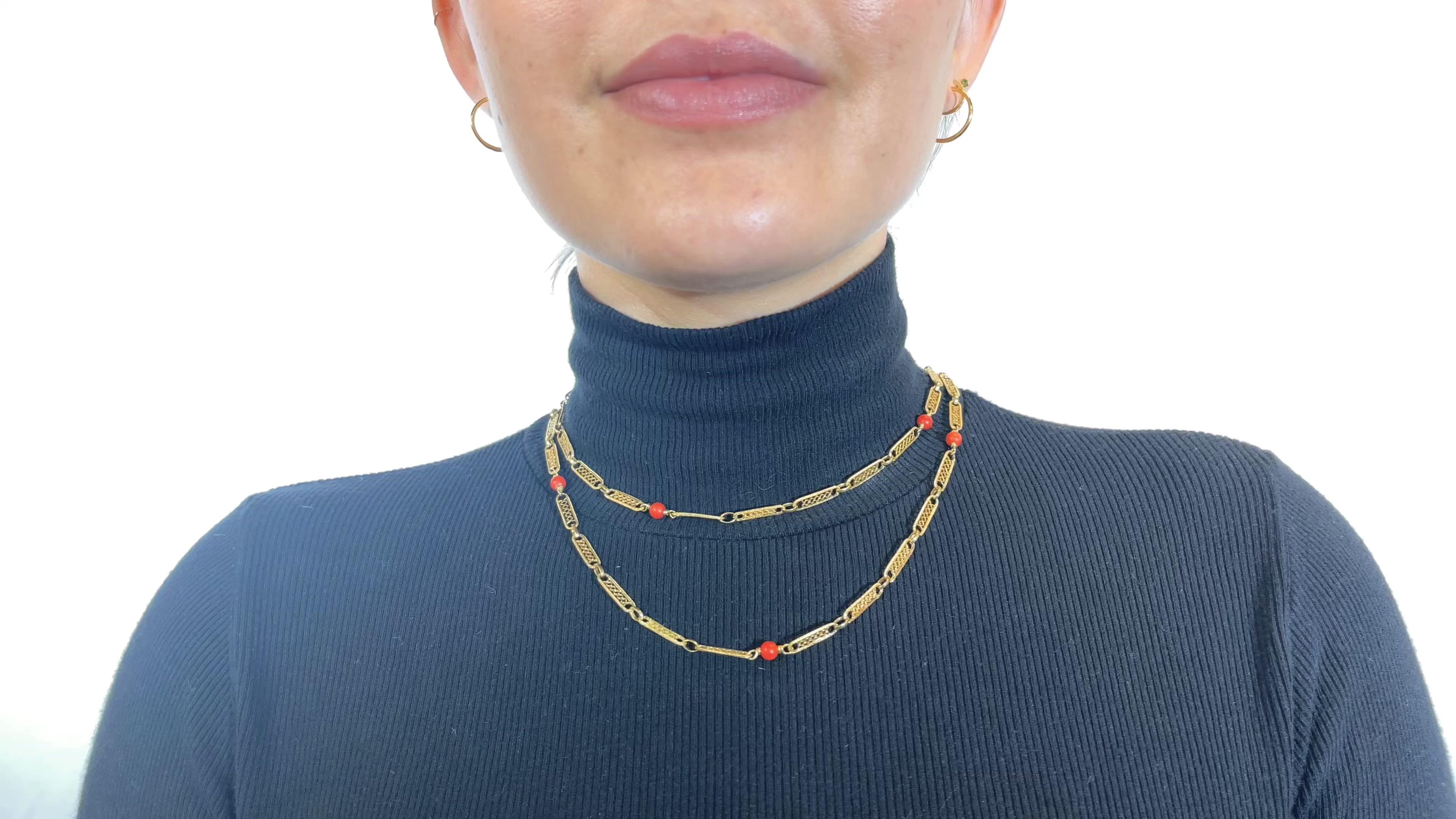One Vintage Italian Coral 18 Karat Gold Fancy Link Necklace. Featuring eight polished coral beads. Crafted in 18 karat yellow gold with Italian hallmarks and maker's mark. Circa 1970s. 

About The Piece: Fun, colorful and truly antique - this