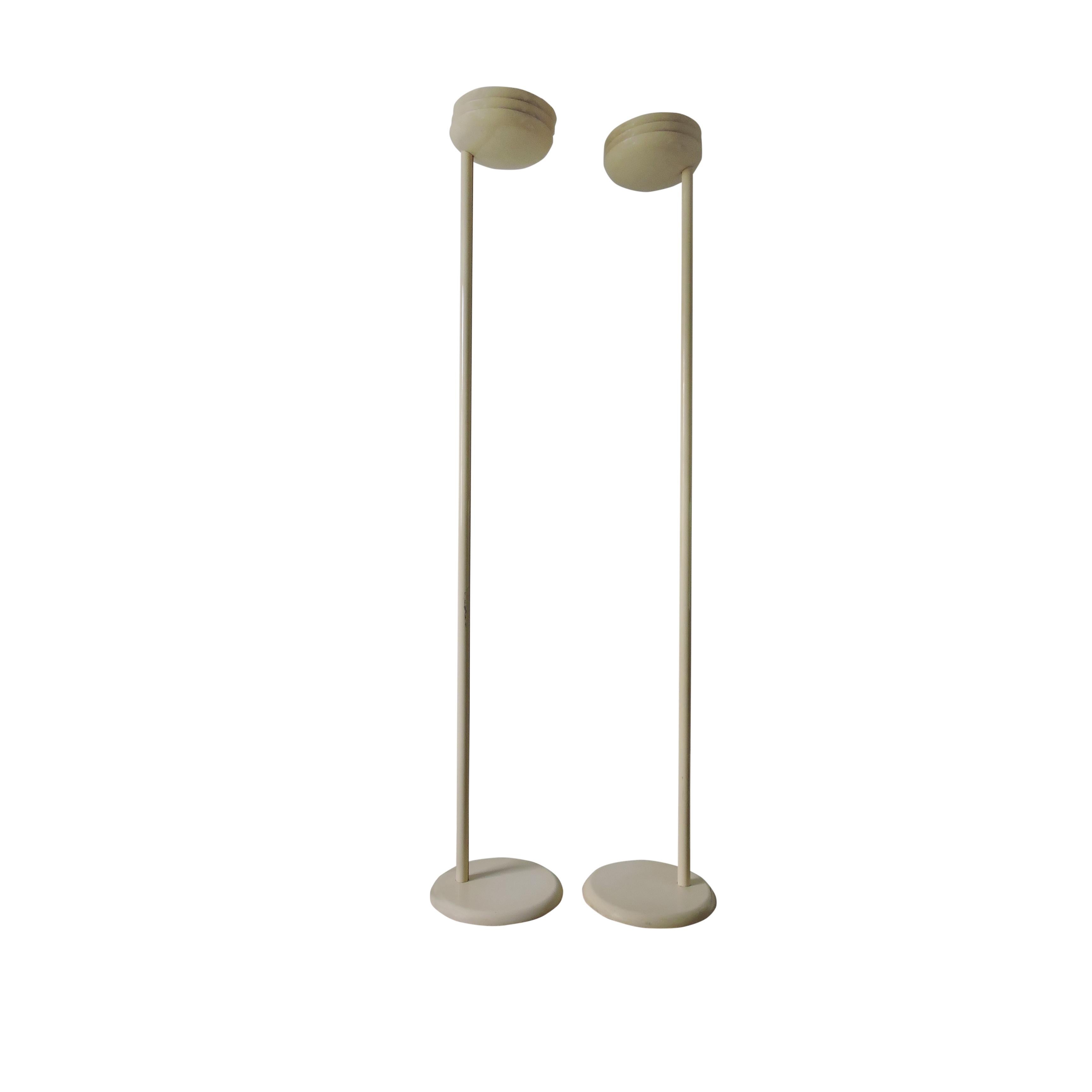 This pair of tall cream floor lamps was produced by Relux in Milan, Italy. The lamps feature reverse dome tops which create a soft up lit glow and a dimmable switch. The lamps are model RL 101/5.