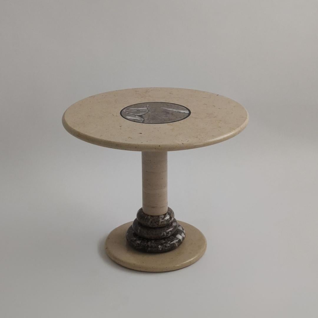 Italian marble accent table
C.1980s
Custom piece made of one solid piece
Grey marble inlaid atop as well as featured on the base creating a beautiful spherical design
Excellent Vintage Condition