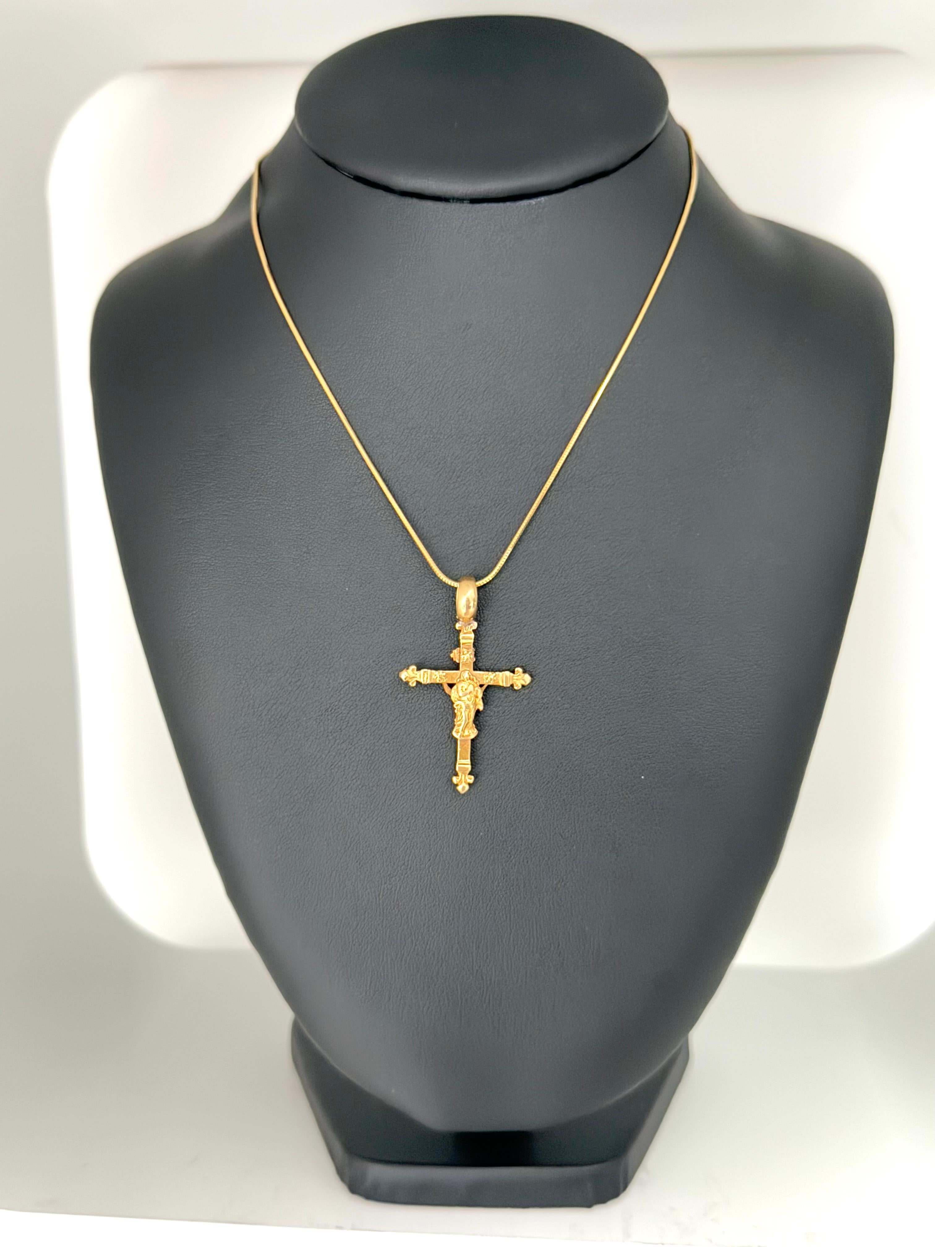 This remarkable vintage Italian crucifix pendant is a deeply symbolic and masterfully crafted piece of religious jewelry, created in luxurious 14 karat yellow gold. Designed with reverence and artistic finesse, it features a rare and meaningful