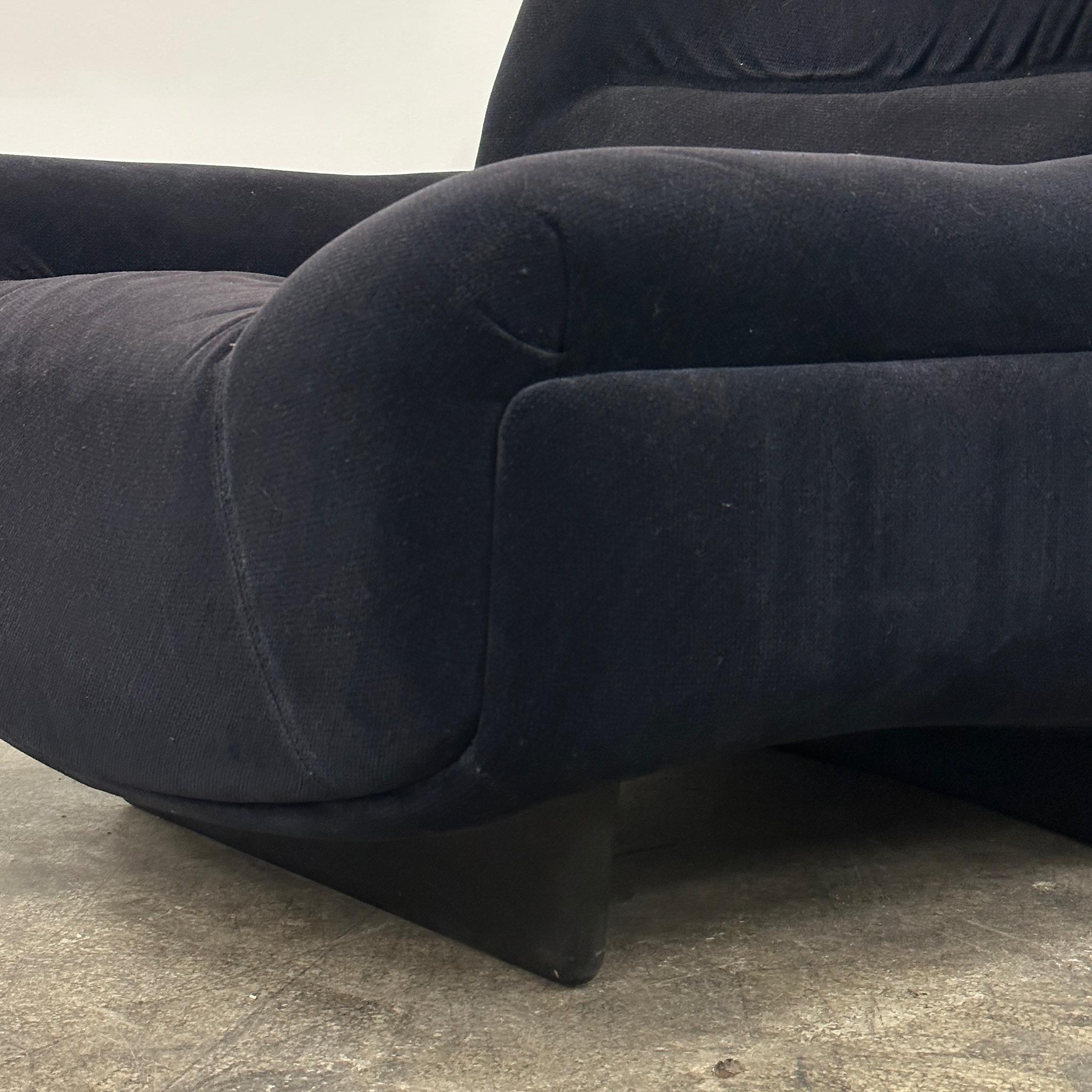 Upholstered in a navy blue fabric. Matching sleeper sofa available as well. On wooden molded base.