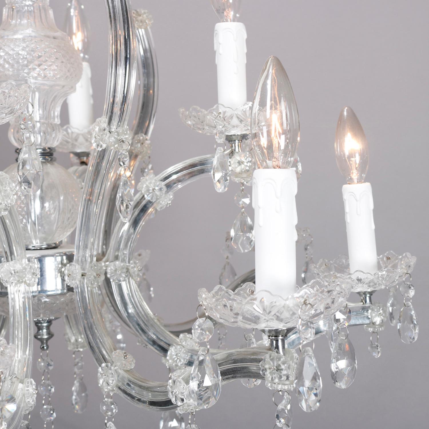 A vintage Italian crystal chandelier offers chrome frame having twelve scroll form arms terminating in candle lights, hanging cut crystals throughout, 20th century

***DELIVERY NOTICE – Due to COVID-19 we are employing NO-CONTACT PRACTICES in the