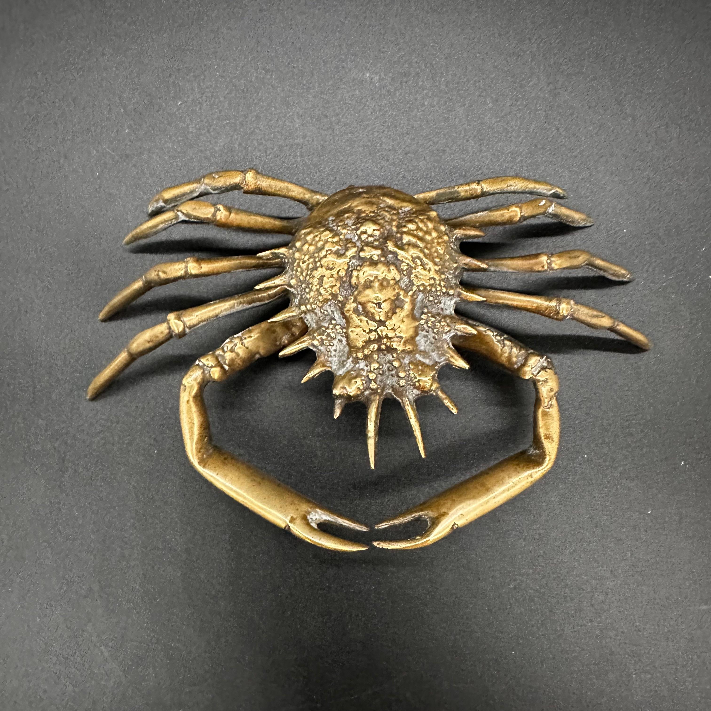 The Vintage Italian Decorative Crab Sculpture from the 1980s showcases the creativity and artistry of Italian design. Crafted with attention to detail, this captivating crab sculpture adds a whimsical touch to any decor, combining the allure of