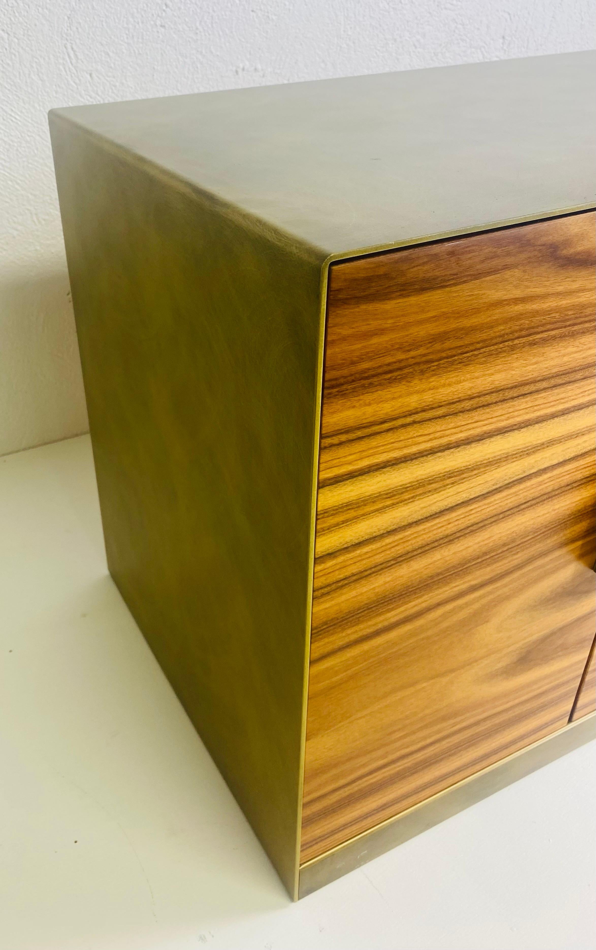 This is a late 20th century vintage Italian design zebra wood four-door chest. This Italian chest has a bronze waterfall design with zebra wood at the front and on the back. This chest is perfect for a side table or nightstand. This chest is Italian