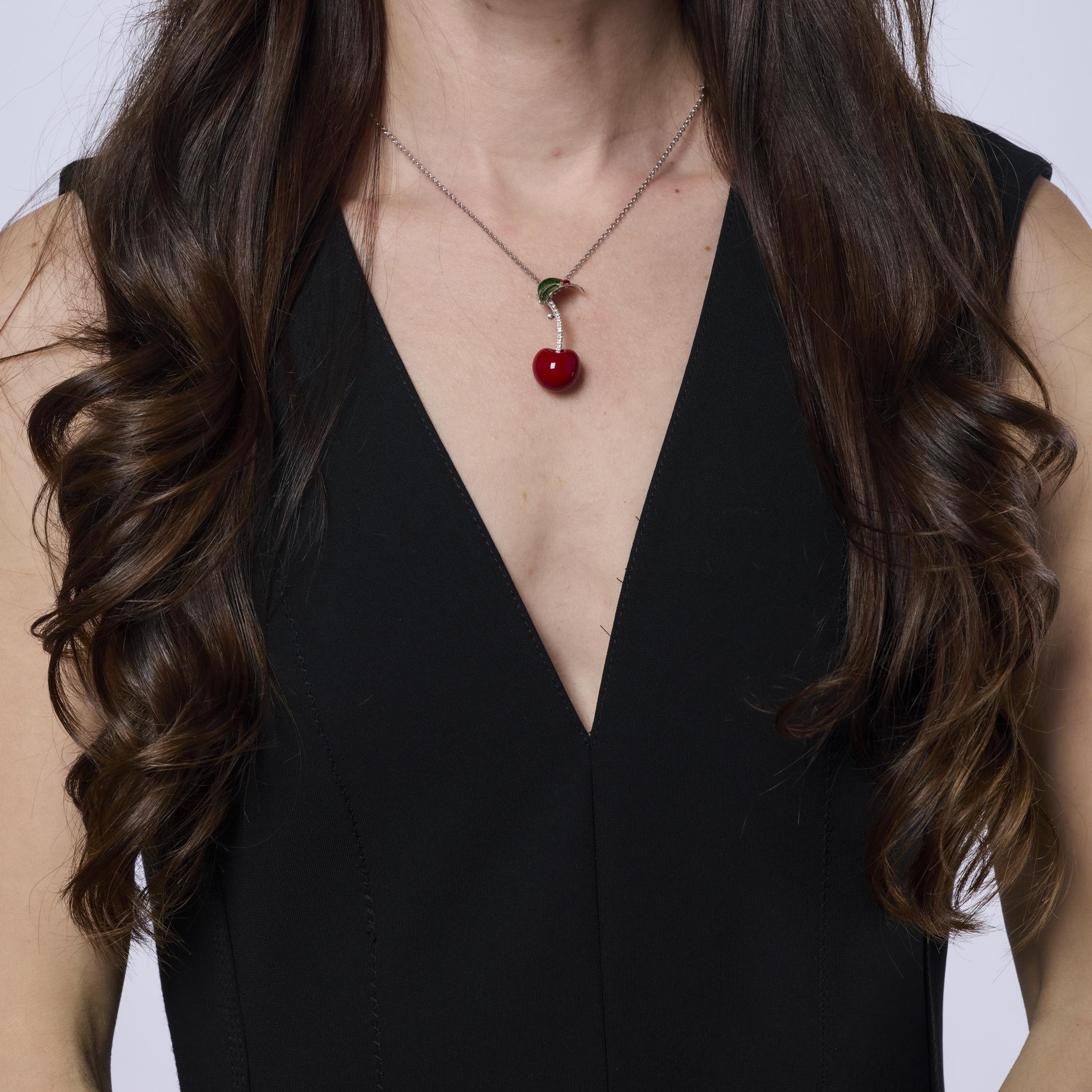This charming vintage Dal Lago necklace features sparkling diamonds set in a mix of 18k white gold, sterling silver, and colorful enamel. Crafted in Italy, it radiates playful sophistication and 1990s style.