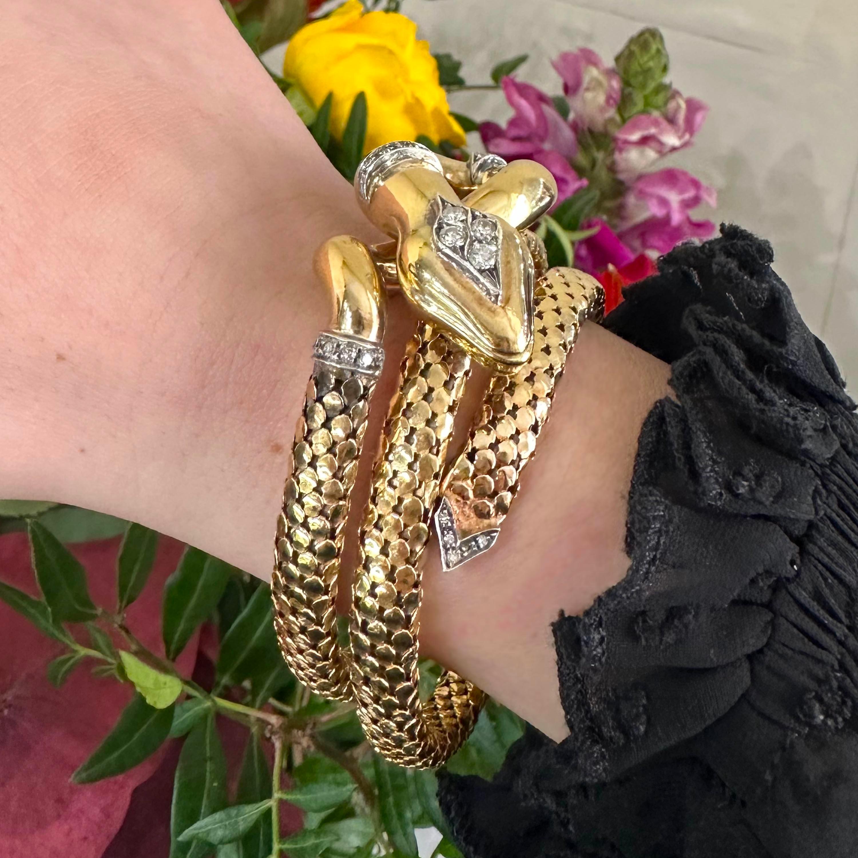  A vintage, coiled snake bracelet, with a polished hollow head, set with round brilliant-cut diamonds, with eight-cut diamonds, in bands, in the neck and tail, in white gold settings, the bracelet has two coils, of shield shape scale links forming