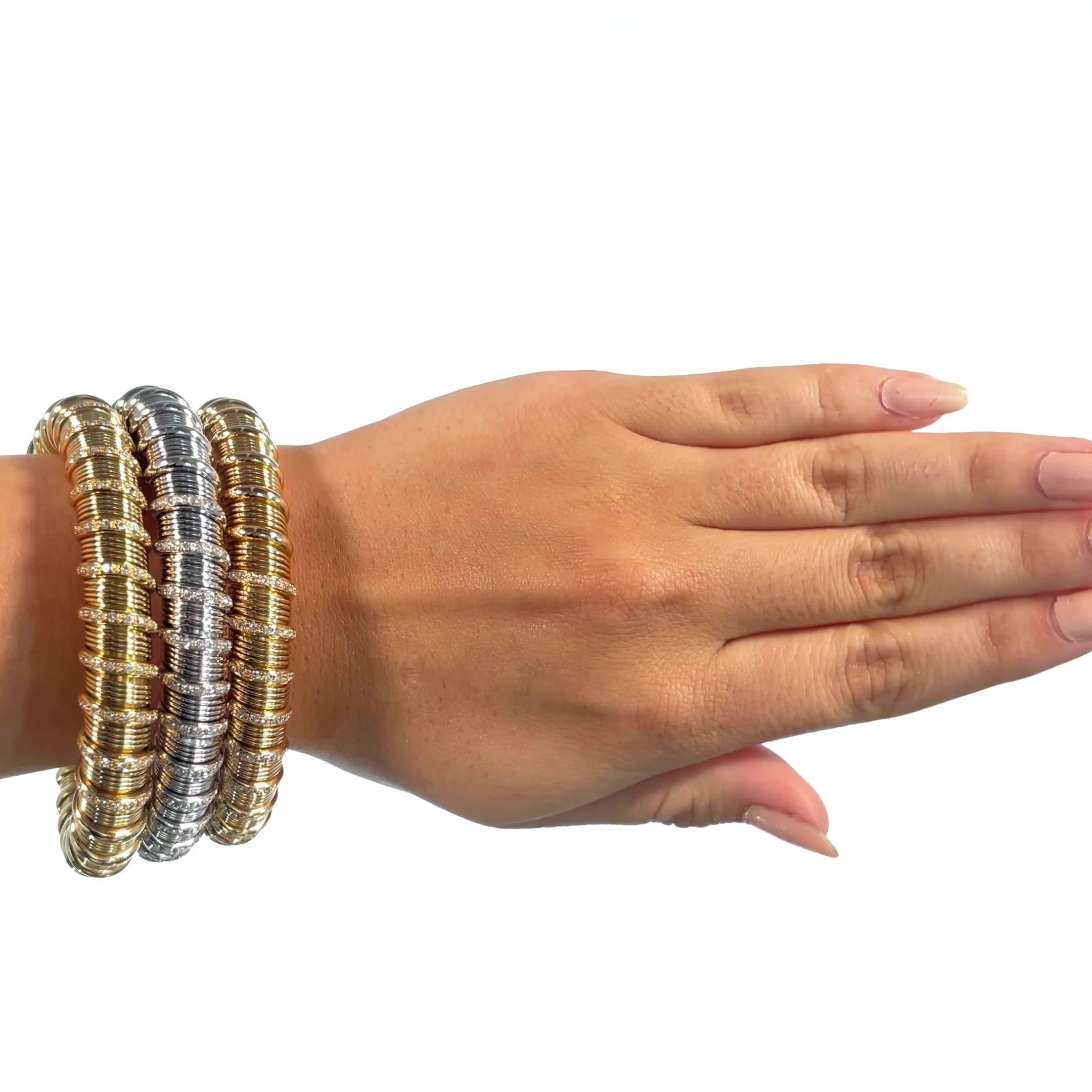 Vintage Italian Diamond Yellow, Rose, White Gold Bangle Set. The set features 231 Round Brilliant Cut diamonds approximately 2.31 carat. Italian hallmarks. Circa 1980s. 

About The Piece: These snake-like bracelets will wrap around your elegant