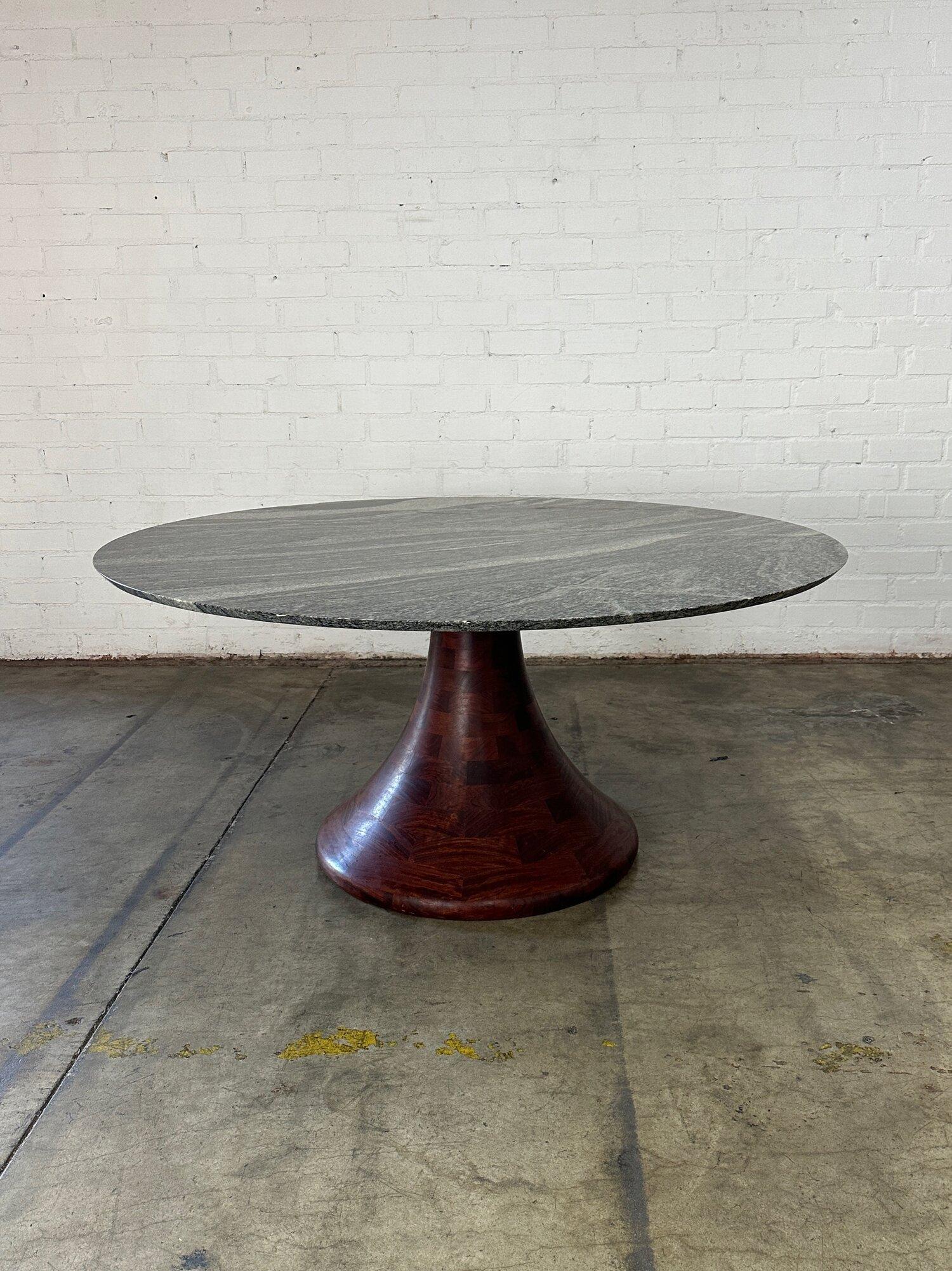 W54 H30.5 KC29

Italian dining table with a stone surface that seems to be marble or granite. Surface is in good overall condition with no major areas of wear. Minor surface touch ups are visible on the second to last photo. Base seems to made of