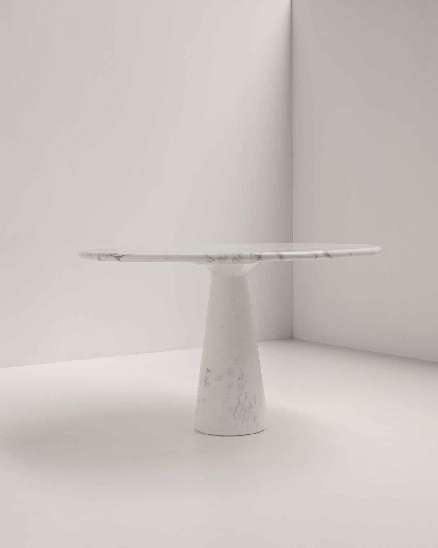 Round dining table, white marble, Italy, 1970s

The table is made of solid Carrara marble and is polished to a satin finish.
The marble has some beautiful veining, but it isn't overpowering, making it a very sophisticated piece.

This table can be