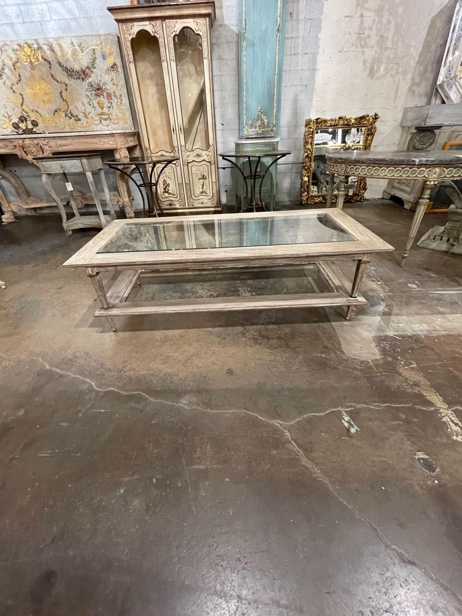 Handsome vintage Italian Directoire style pickled oak and brass coffee table with glass top. Very nice patina and mixes well with a variety of styles. Lovely!!