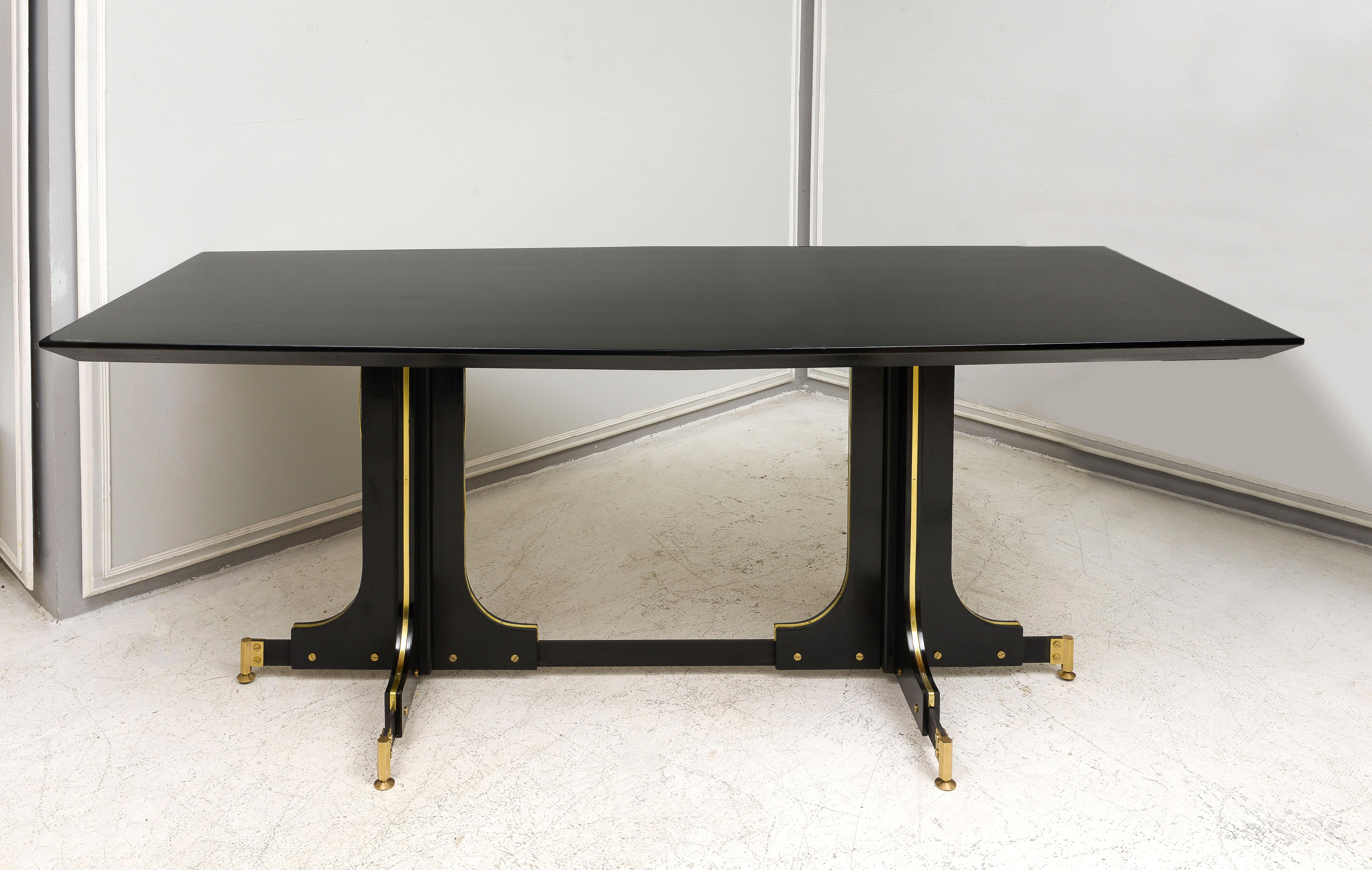 Vintage Italian ebonized table with bronze details.
Measures: The depth in center of table is 35.5