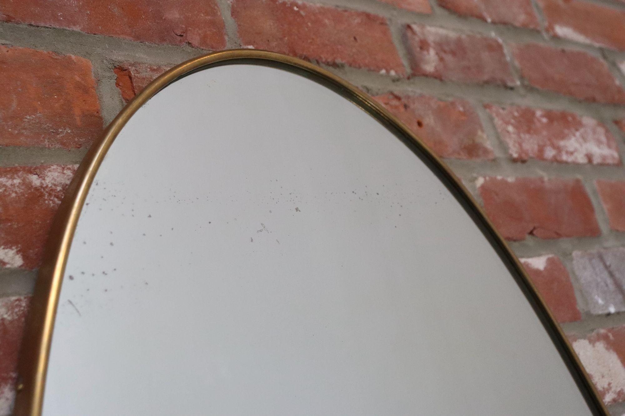 Miroir mural elliptique italien vintage avec cadre en laiton d'après Gio Ponti en vente 4