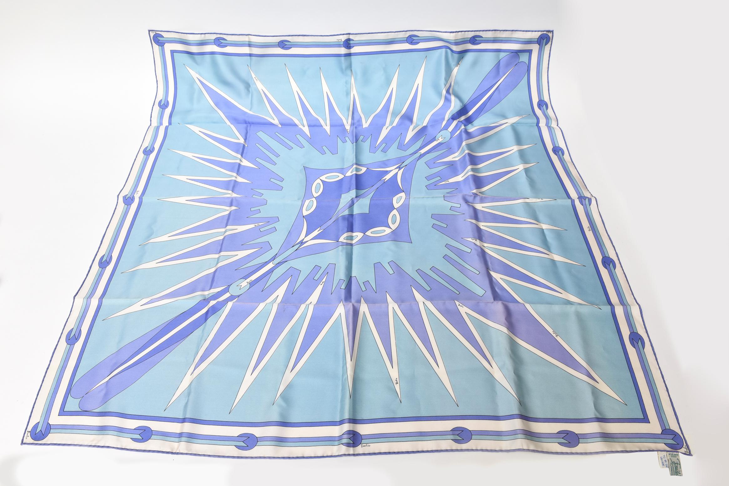 This gorgeous vintage Italian silk Emilio Pucci geometric square scarf has beautiful colors and patterns. This is an old tag from the late 60's or early 70's. The array of blue and purple tones is so happy and peaceful yet vibrant. It is 100% pure
