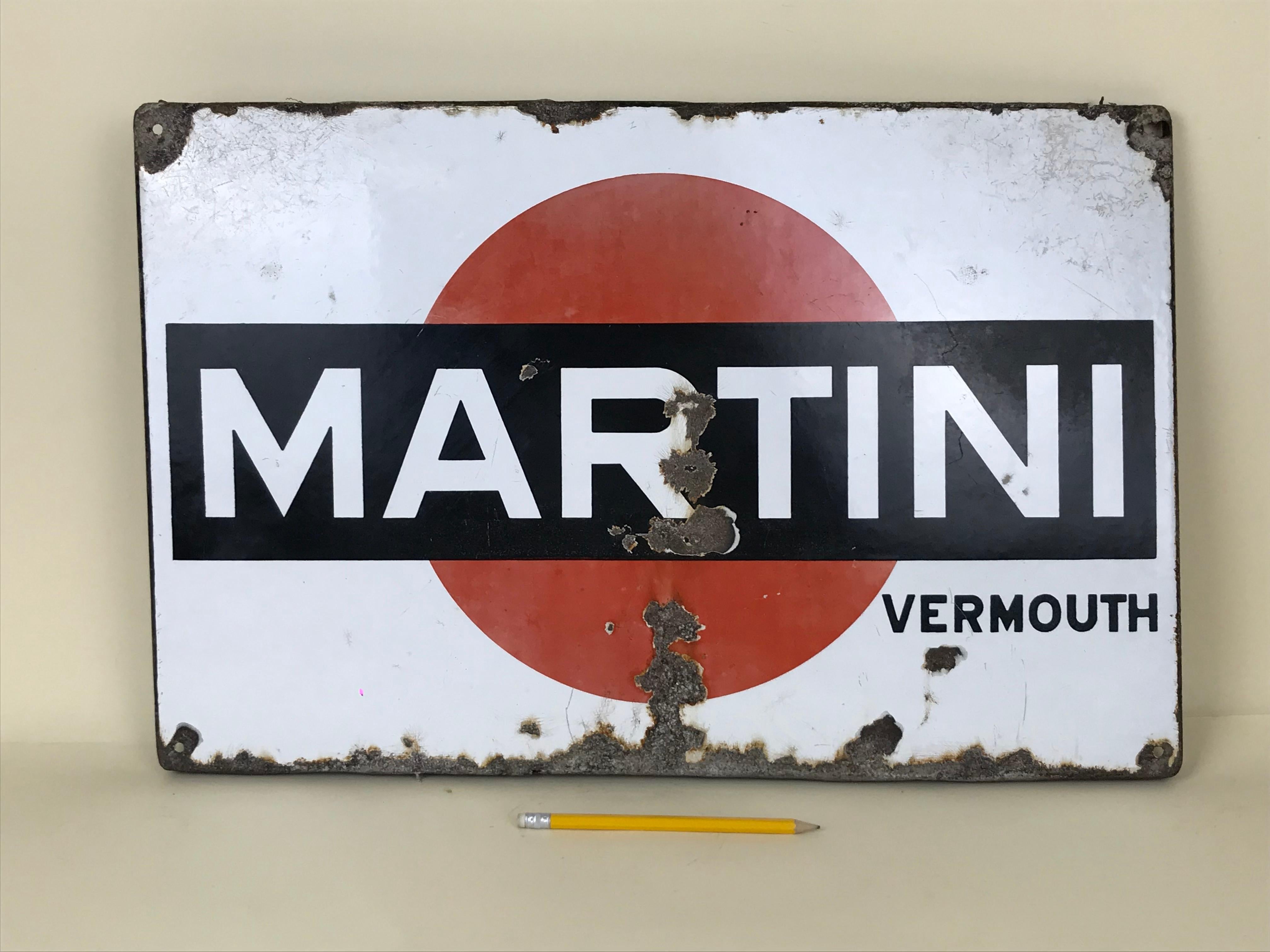This enamel metal sign of Martini Vermouth was produced in the 1950s in Italy. In this advertising sign the Martini logo is placed on white background.

Collector's note:

Martini is a brand of Italian vermouth, named after the Martini & Rossi