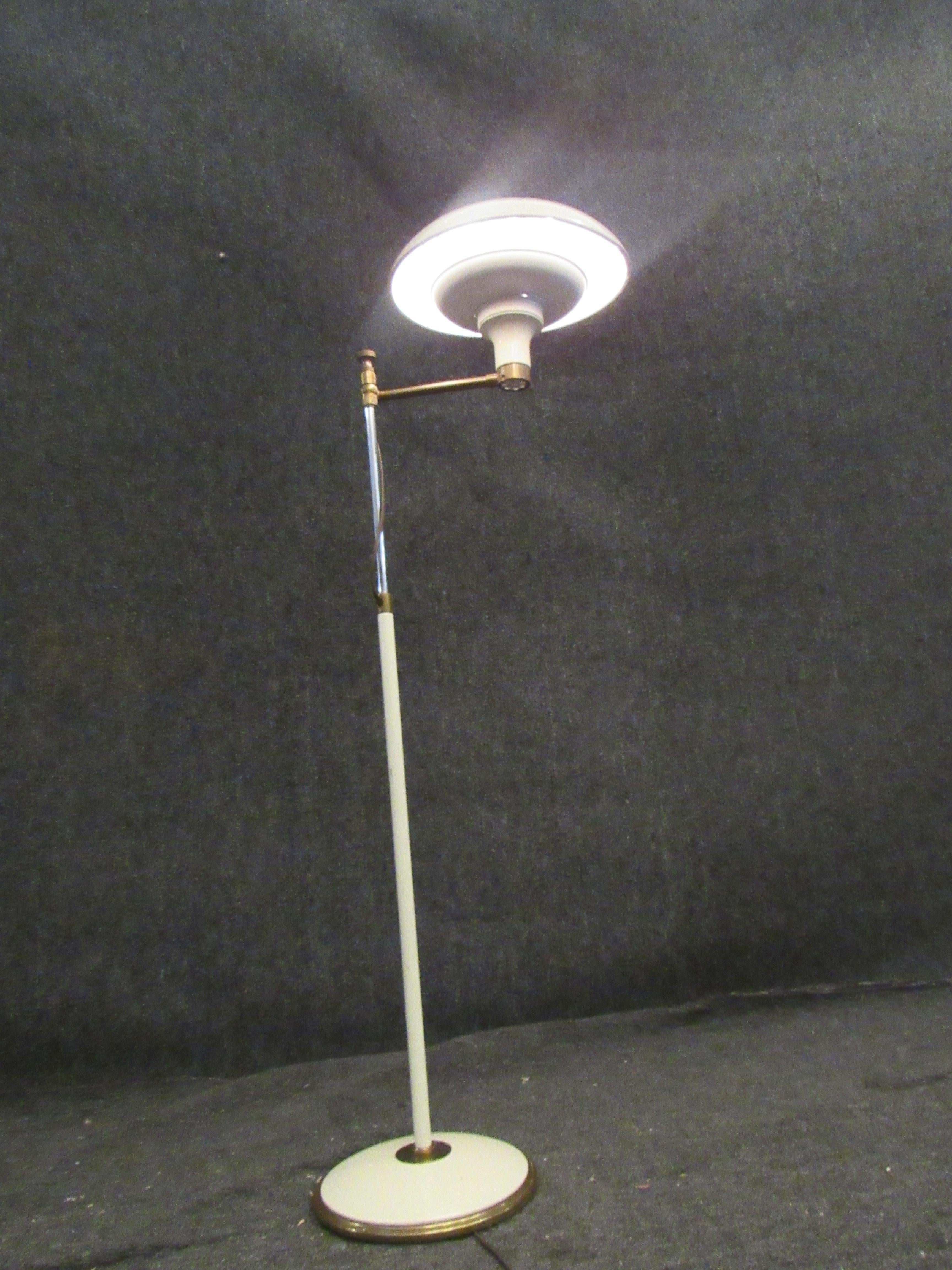 Amazing vintage Italian brass floor lamp with a unique adjustable height arm. A 12