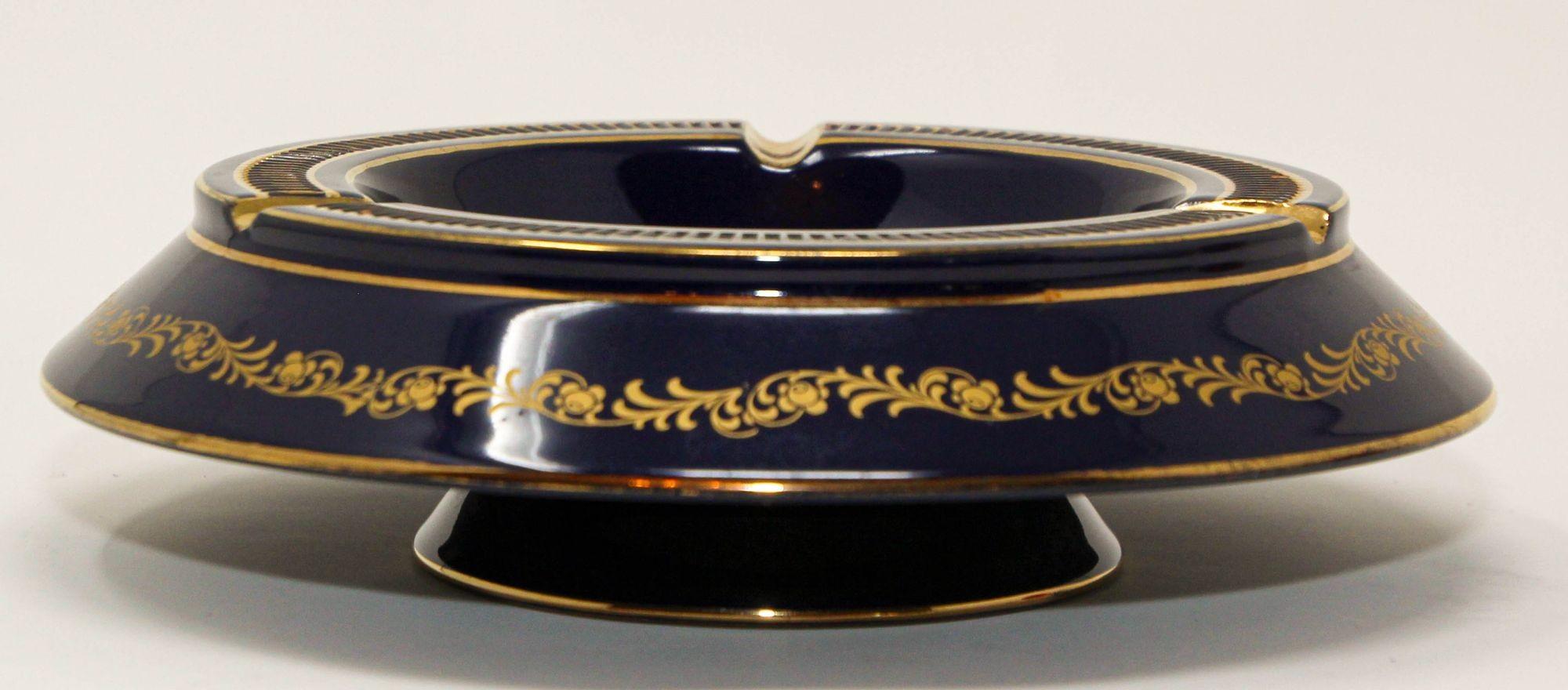 Hand painted gilded cobalt blue KBNY Ashtray Capodimonte Italy.
Vintage Limoges, Sevres style porcelain ashtray in cobalt royal blue with fine gold decor.
Beautiful Collectible royal blue porcelain ash tray handcrafted and hand painted with