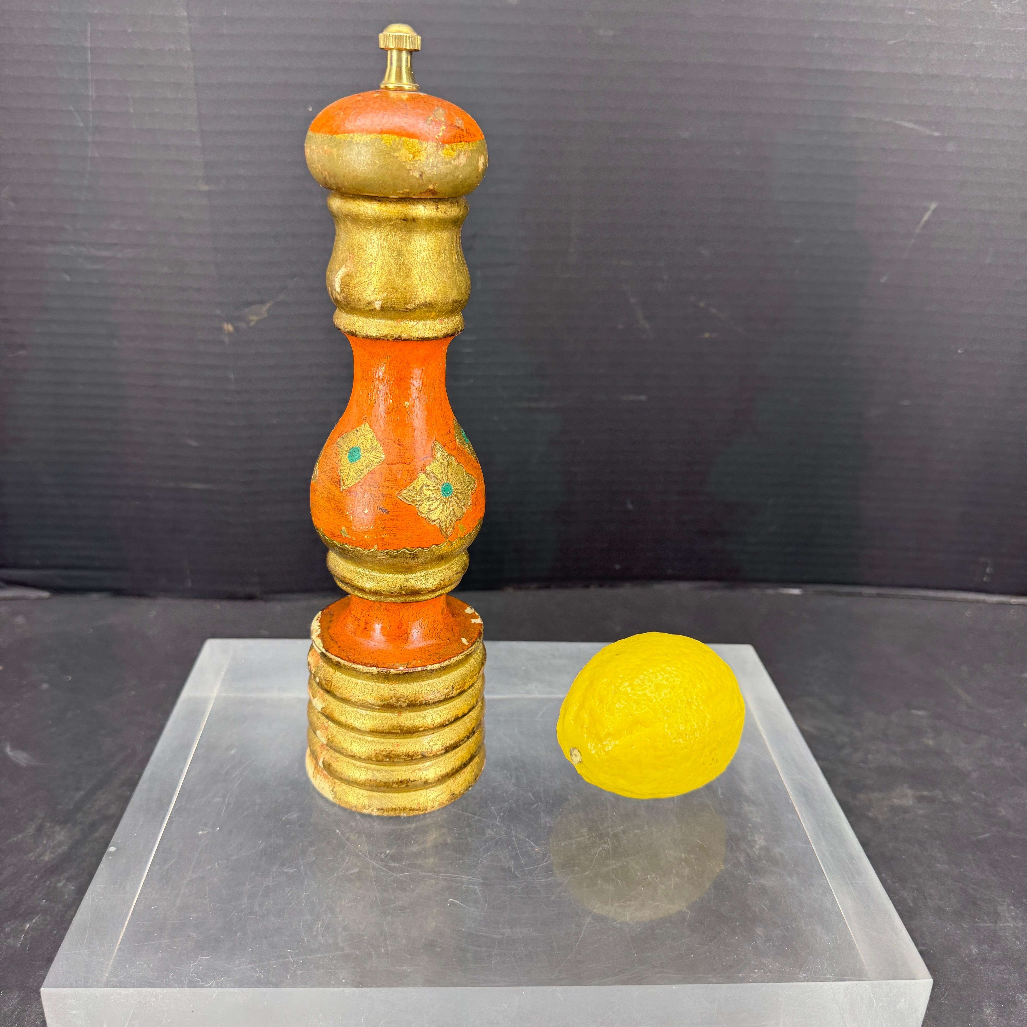 Tall and sturdy Vintage Mid-Century Modern Italian orange and gilt pepper grinder or shaker with its original patina. Just need to unscrew the top when ready to refill. This piece, marked Made in Italy on the bottom looks fantastic on a kitchen