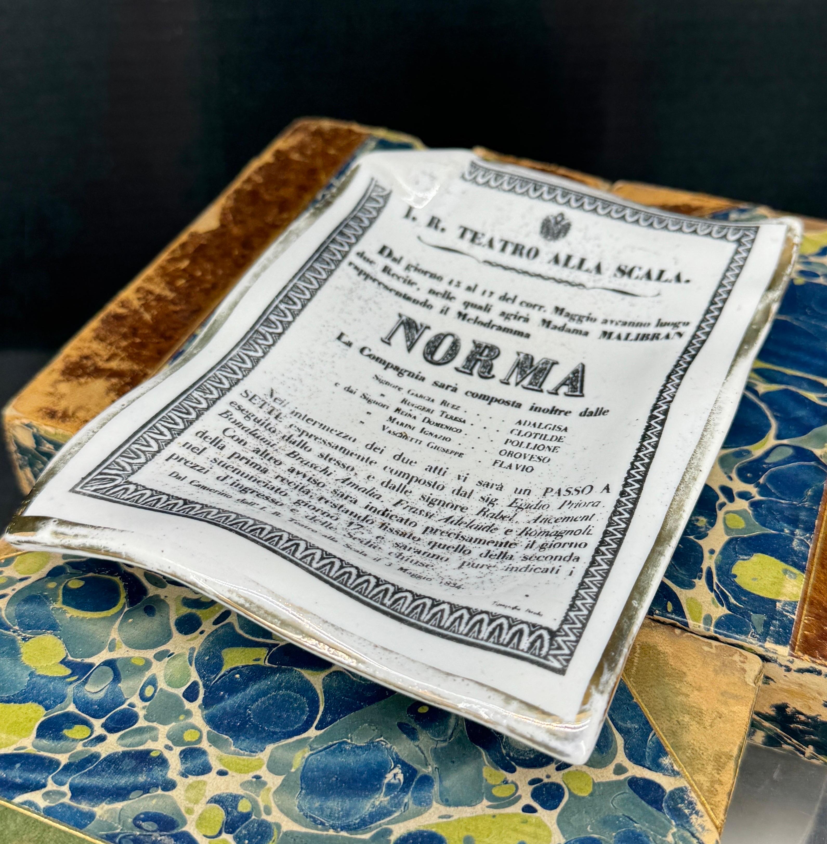 Vintage Piero Fornasetti Milano Italian ceramic dish from Fornasetti’s Poster Page Series from Teatro Alla Scala Norma Opera 1831. Could be used on a desk, as a trinket tray holding jewelry on a vanity, on top of books on a coffee table or even as