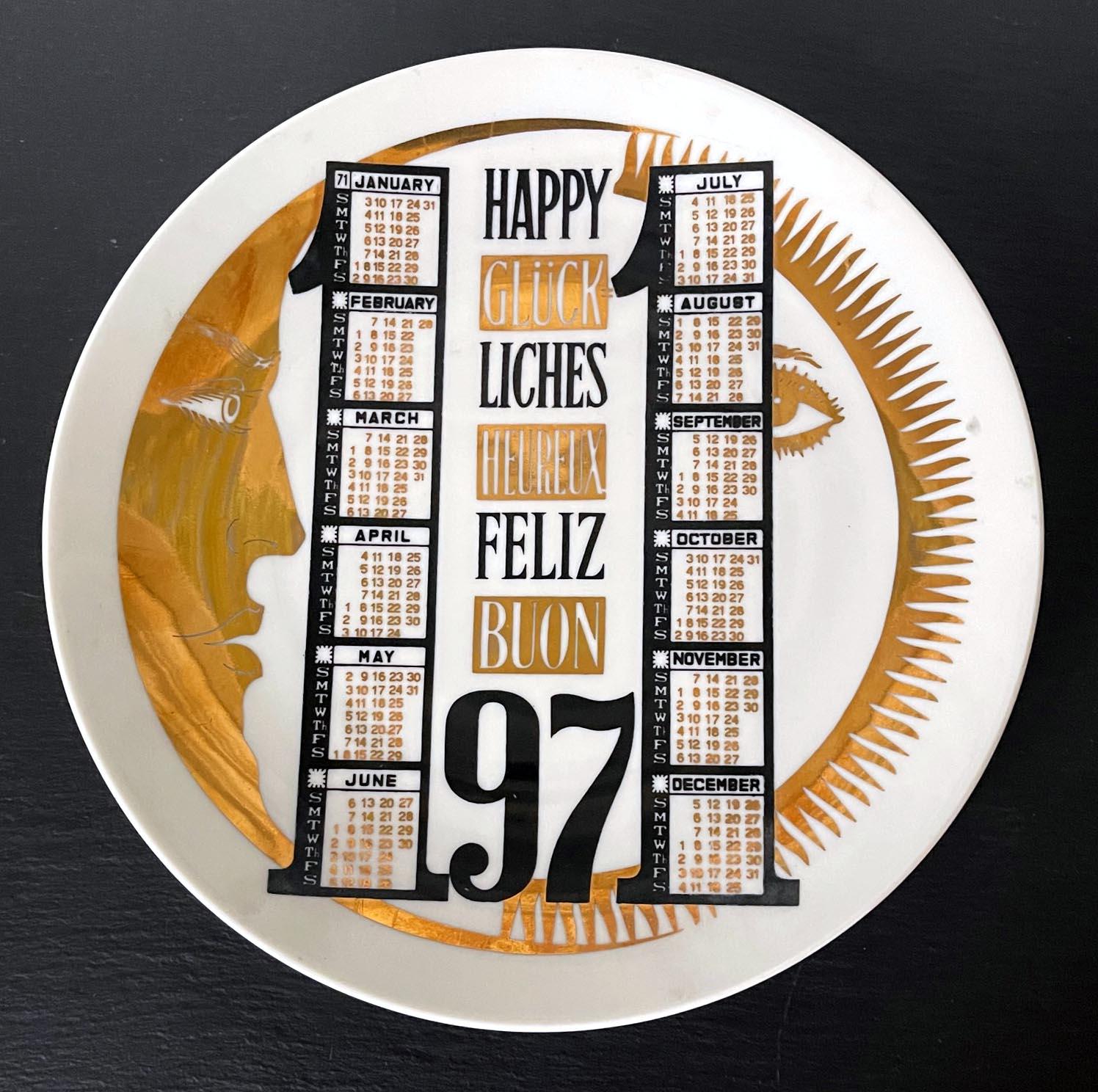 A vintage Italian decorative porcelain plate designed by Piero Fornasetti and made by Fornasetti. The commemorative plate is for the year of 1971 and features the iconic sun and moon motif by the artist. The monthly calendar was smartly placed