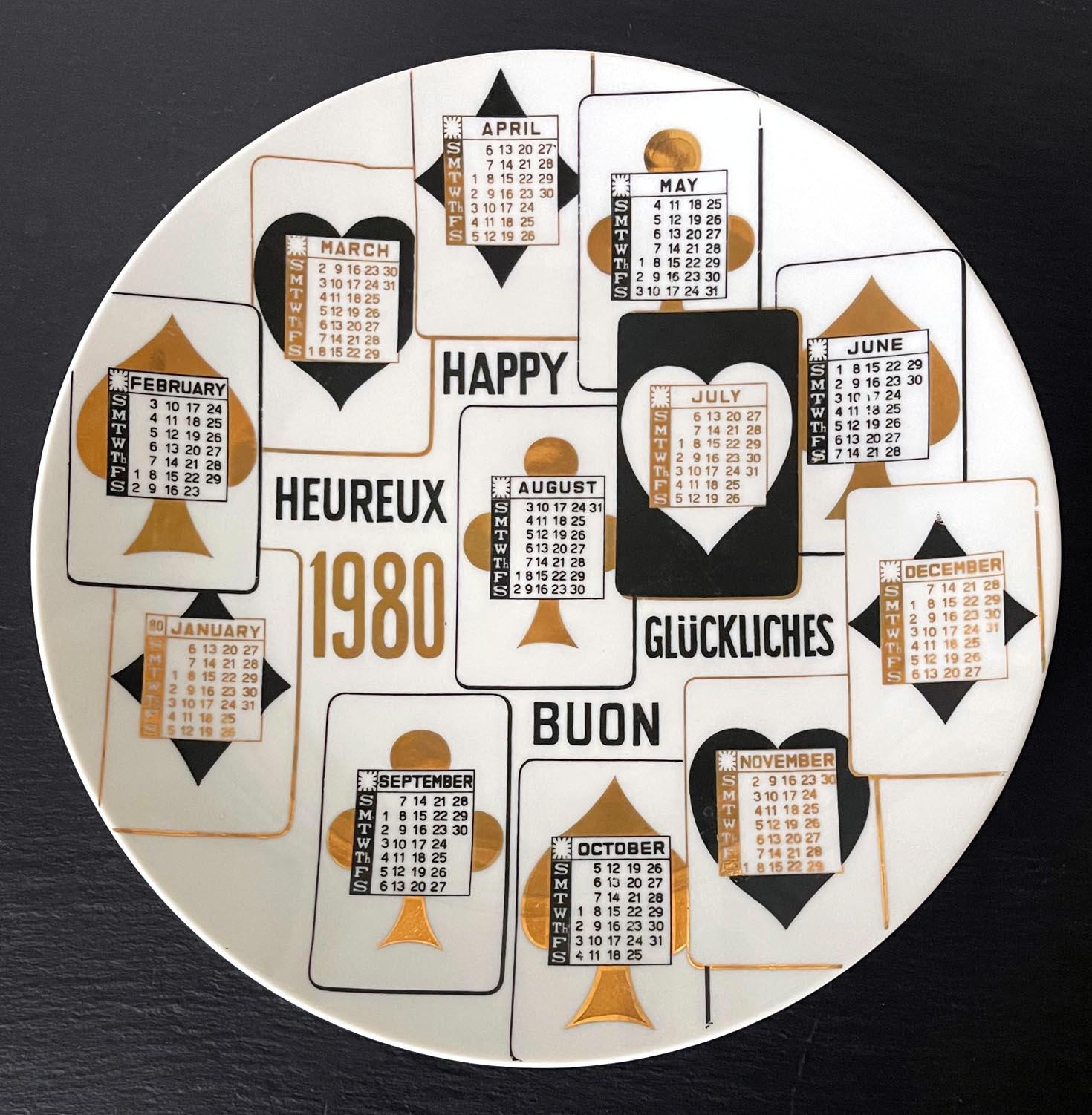 A vintage Italian decorative porcelain plate designed by Piero Fornasetti and made by Fornasetti. The commemorative plate is for the year of 1980 and features the iconic house of the card motif by the artist. The monthly calendar was smartly placed