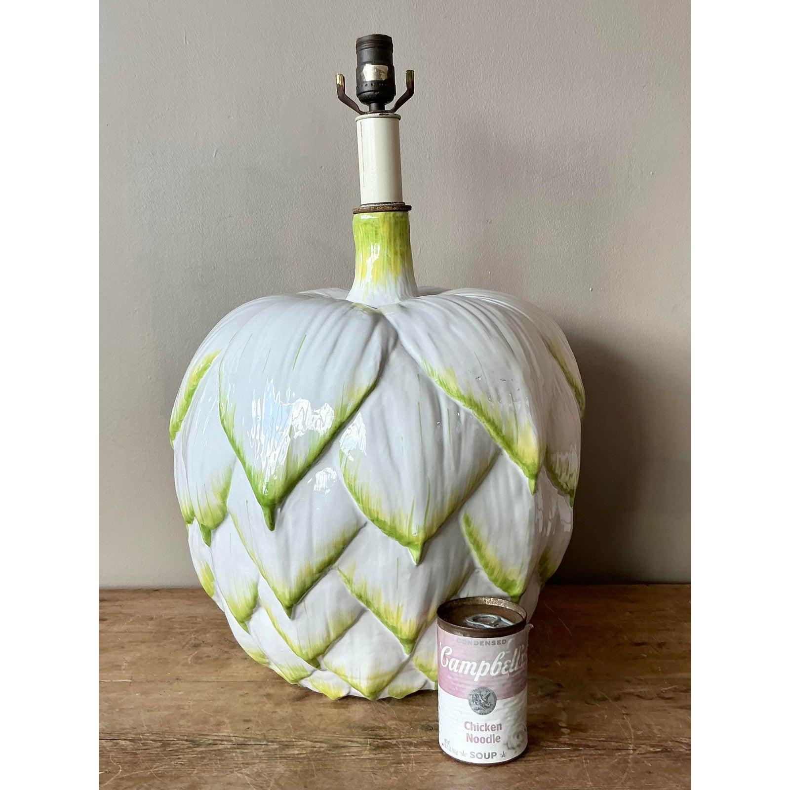 This charming table lamp is a quintessential example of high-end novelty lighting, designed to introduce organic texture and playful sophistication to any room. Crafted in Italy, the sculptural ceramic body is beautifully molded in the detailed form