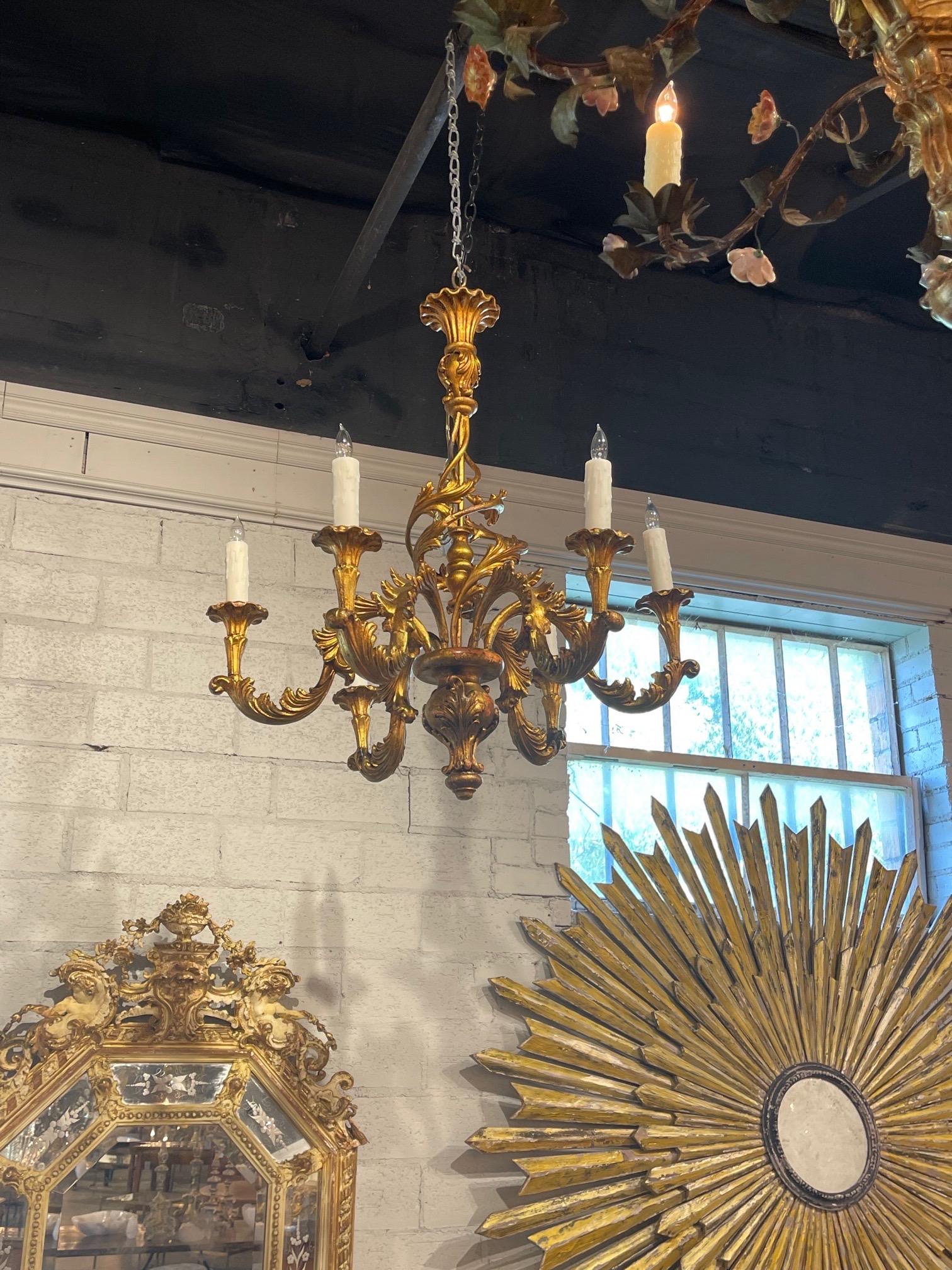 Handsome vintage Italian gilt 6 light chandelier. Beautiful decorative arms and great scale and shape. A classic look that adds a touch of elegance!! 