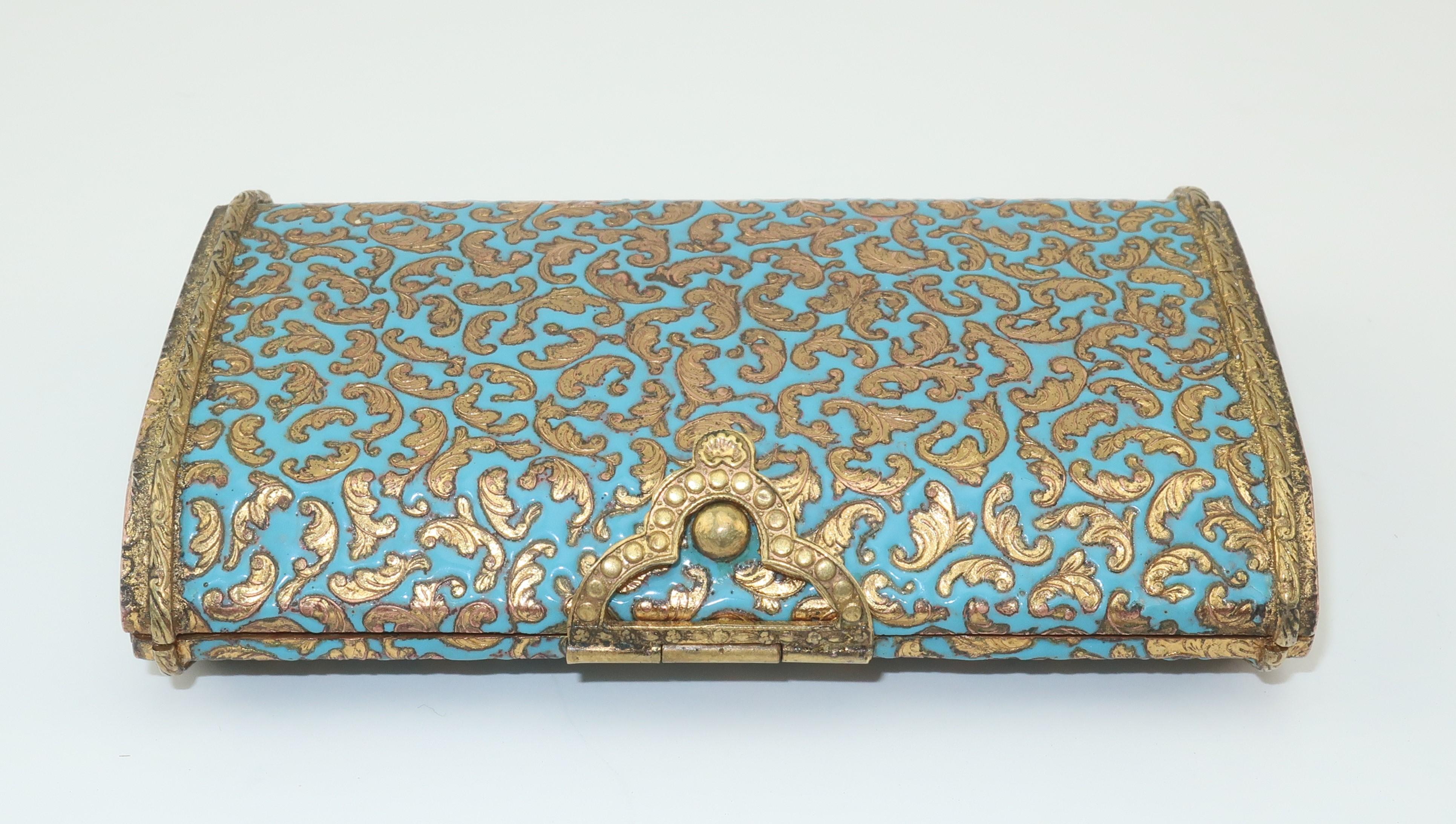 Beautiful early 1900's Italian gilt metal cigarette case with intricate details and a turquoise enamel decoration similar in style to cloisonne.  The case features a nob closure with a spring loaded hinge for easy one handed access to filterless