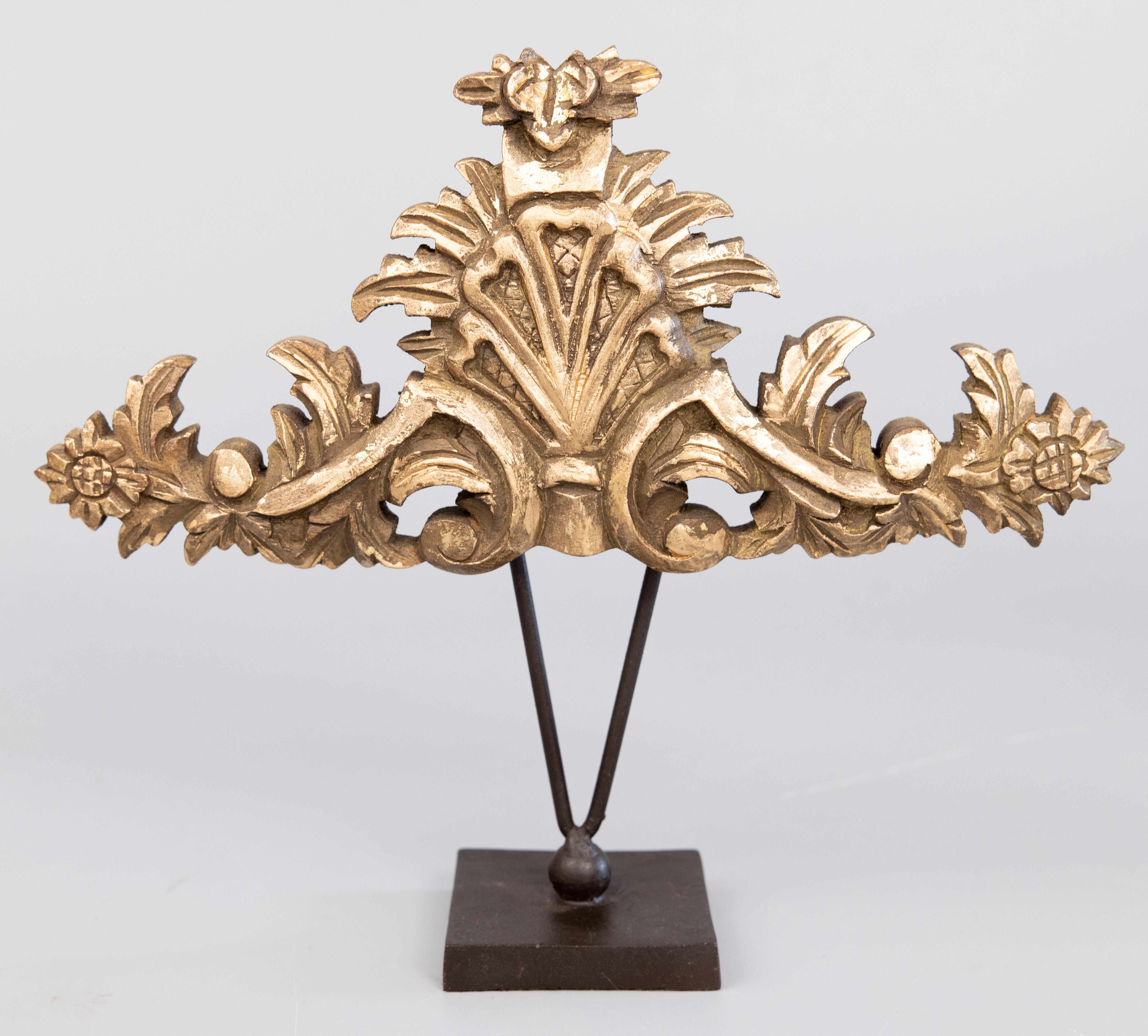 A lovely set of Mid-Century Italian giltwood fragments / architectural elements on metal stands. These stunning fragments have a lovely gilt patina and would be perfect on a bookshelf or for display in any room. One fragment is 14
