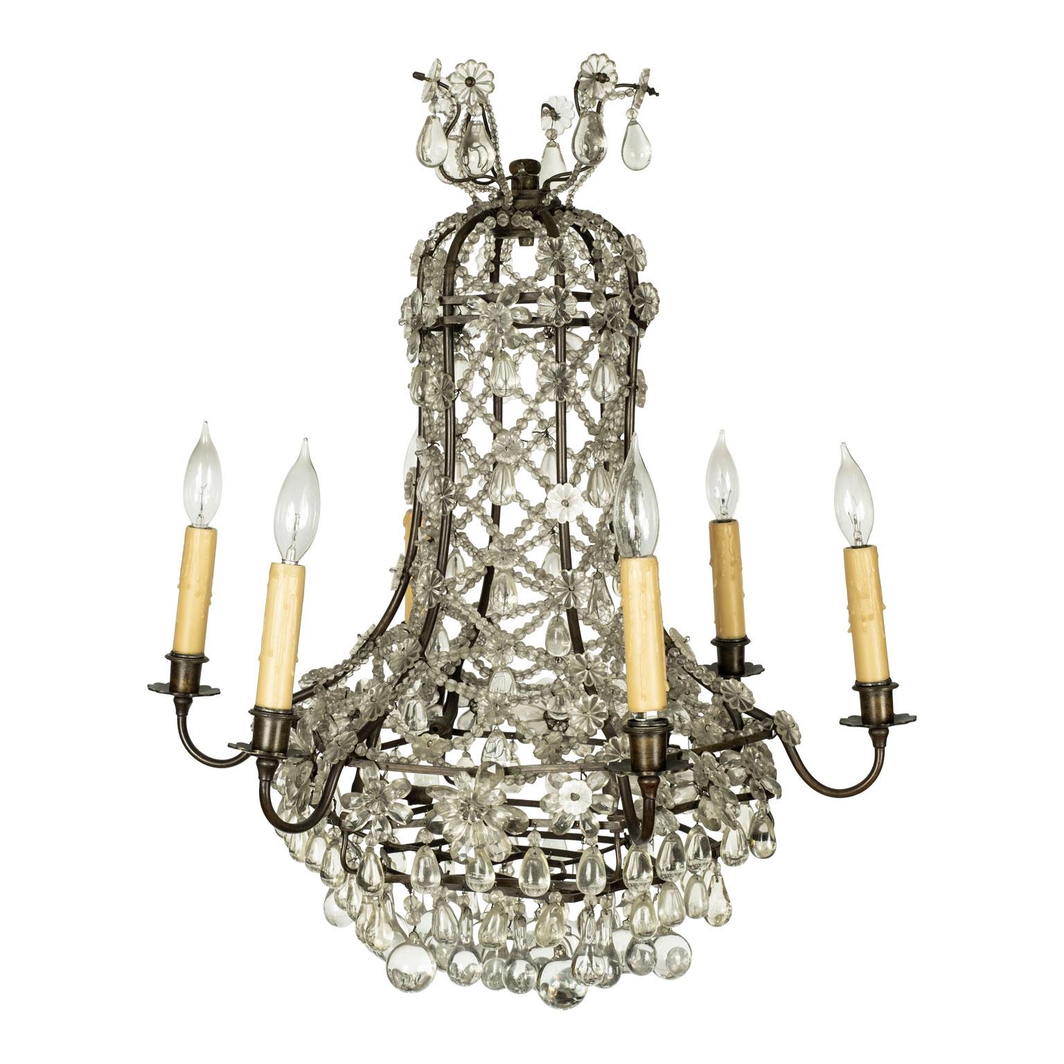 Vintage Italian glass and crystal chandelier circa 1930-1950. Brass and iron frame chandelier decorated in cut crystal prisms, pressed glass flowers, blown glass pendants and glass bead chains. Wired for use within the USA. Six arms each supporting