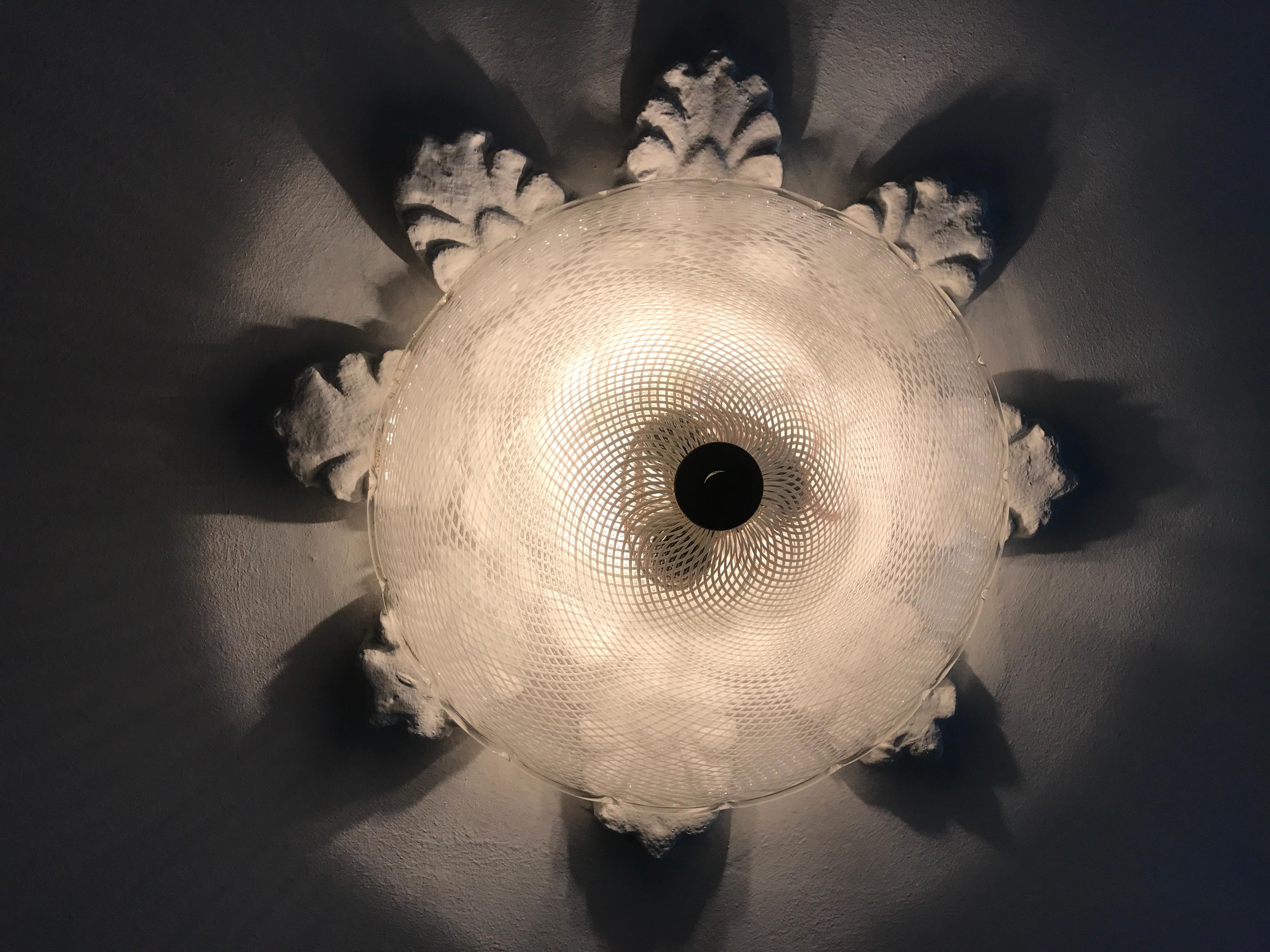 Beautiful ceiling light in clear glass with white pattern, brass fittings.