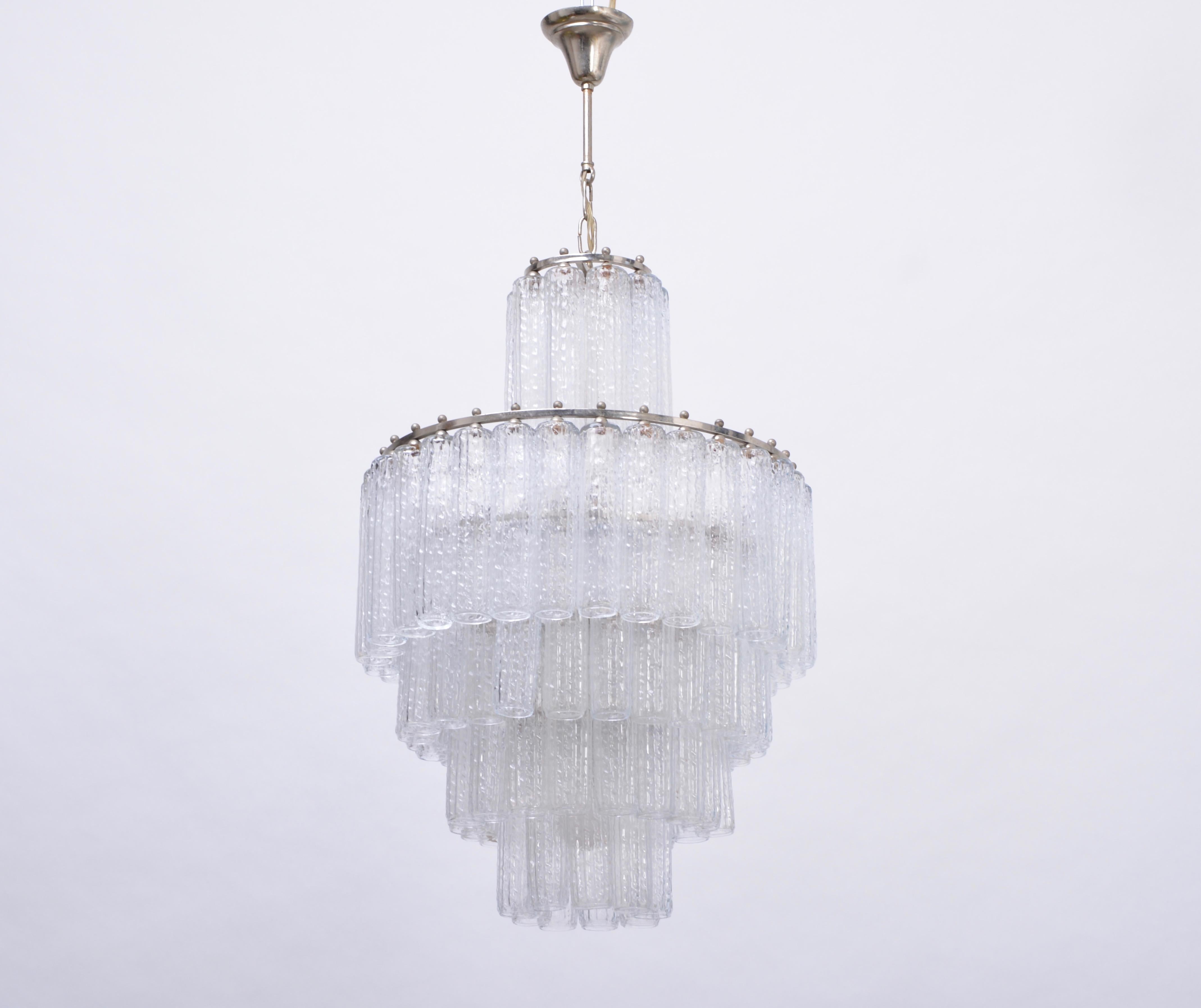 Italian Mid-Century Modern Glass chandelier in the style of Venini

Vintage Italian chandelier with 91 cylindrical shaped handmade Murano glass tubes, mounted in three layers on nickel metal frame.