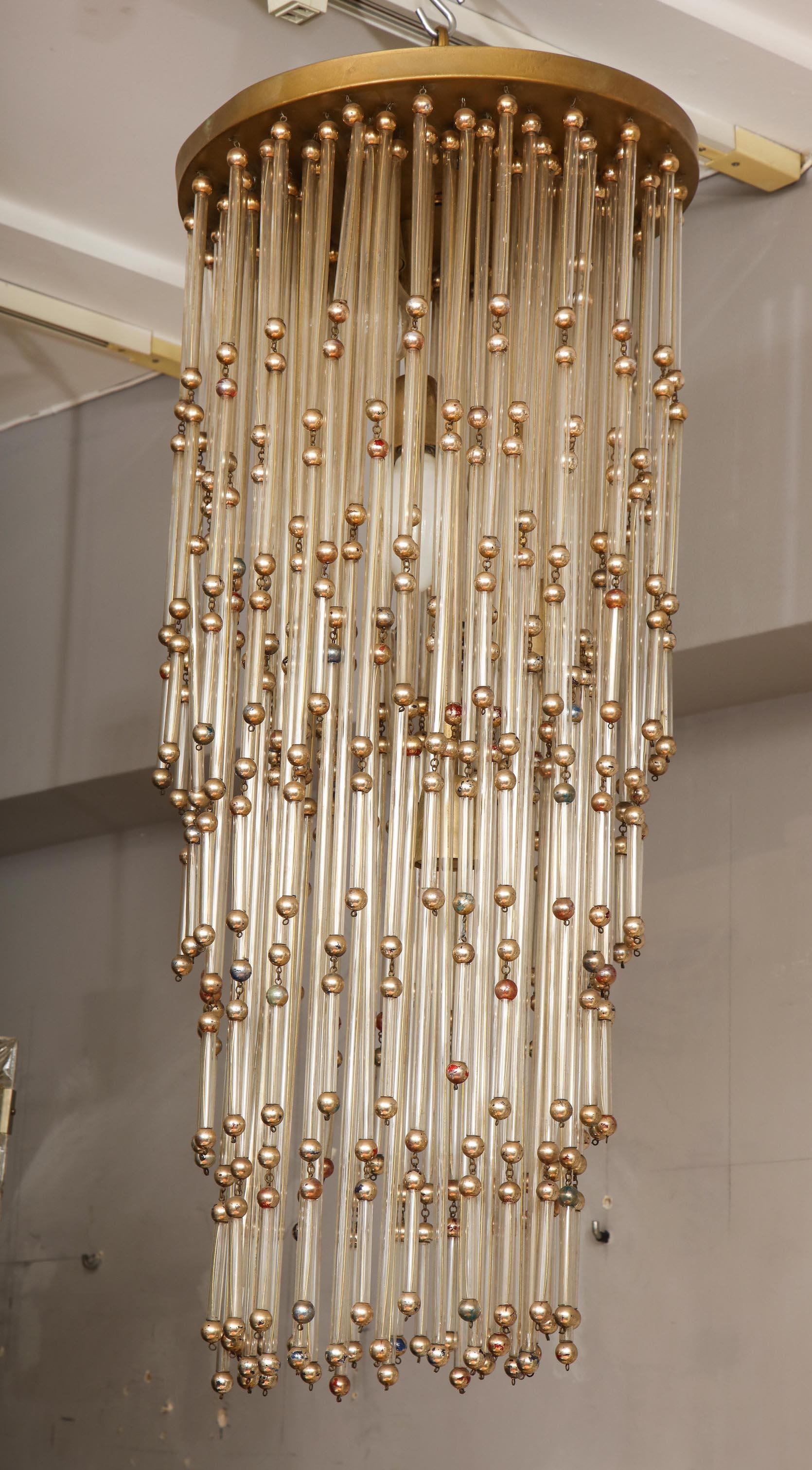 Vintage Italian glass chandelier. The chandelier condition is fair. Silver foiled peeling off, revealing blue and pink paint surface on beads. Transparent tubes made of acrylic have some scratches. 