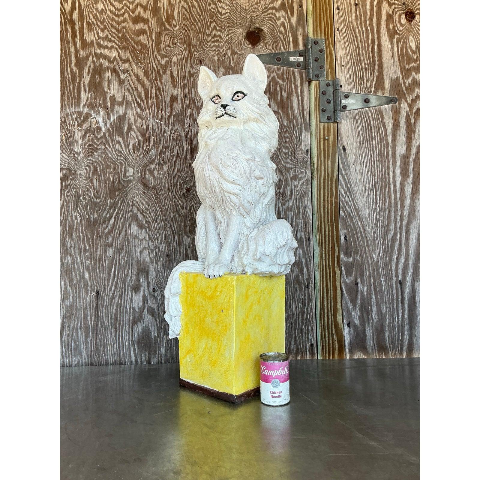 Add a touch of whimsical charm to your space with this vintage Italian glazed ceramic cat sculpture, featuring an intricately sculpted feline perched atop a bold yellow pedestal. The crackled white glaze highlights the lifelike detailing of the