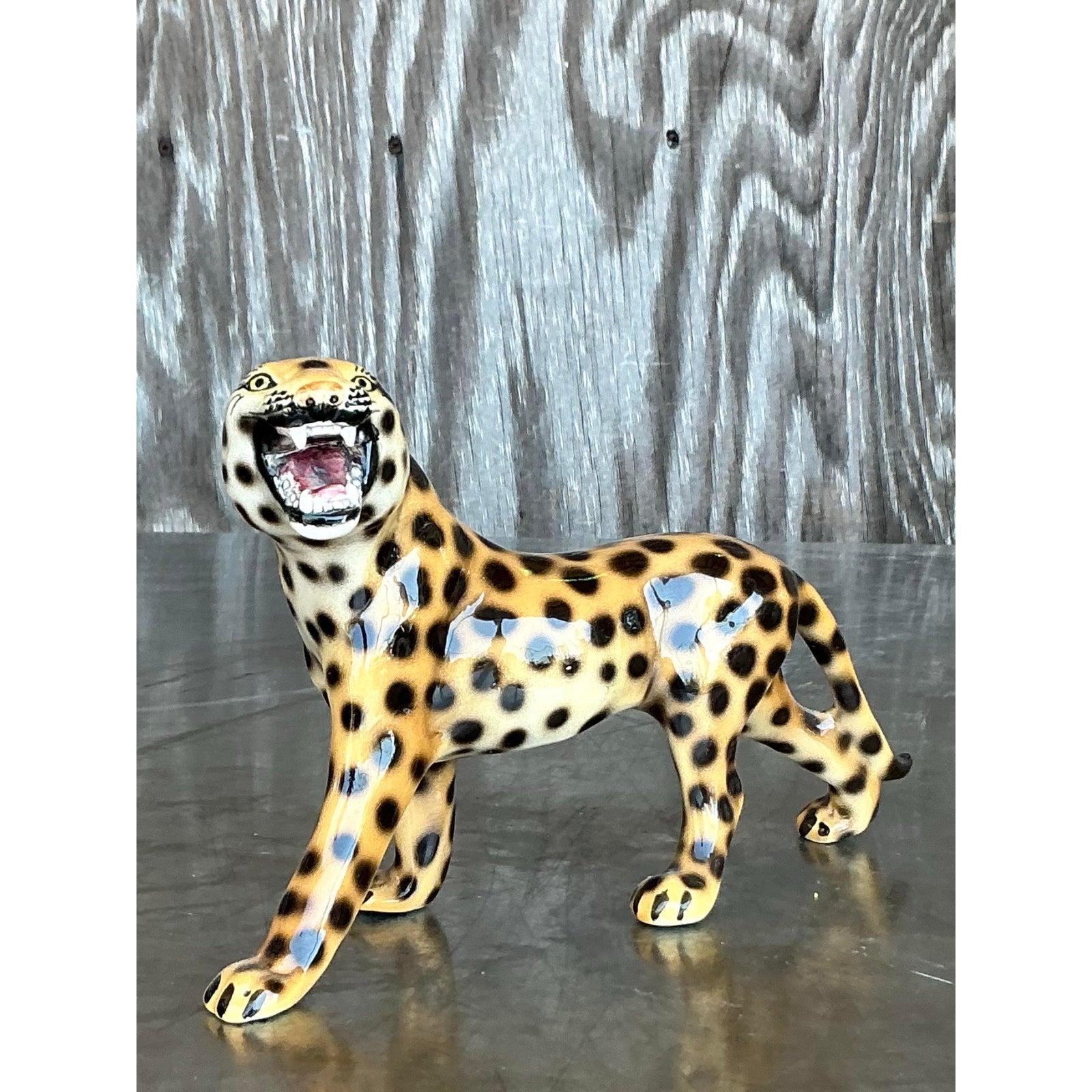 Unleash a bold burst of personality into your décor with this Vintage Italian Glazed Ceramic Leopard. Crafted with striking hand-painted detail, this fierce feline features a vivid, high-gloss glaze and dramatic spotted pattern that captures the